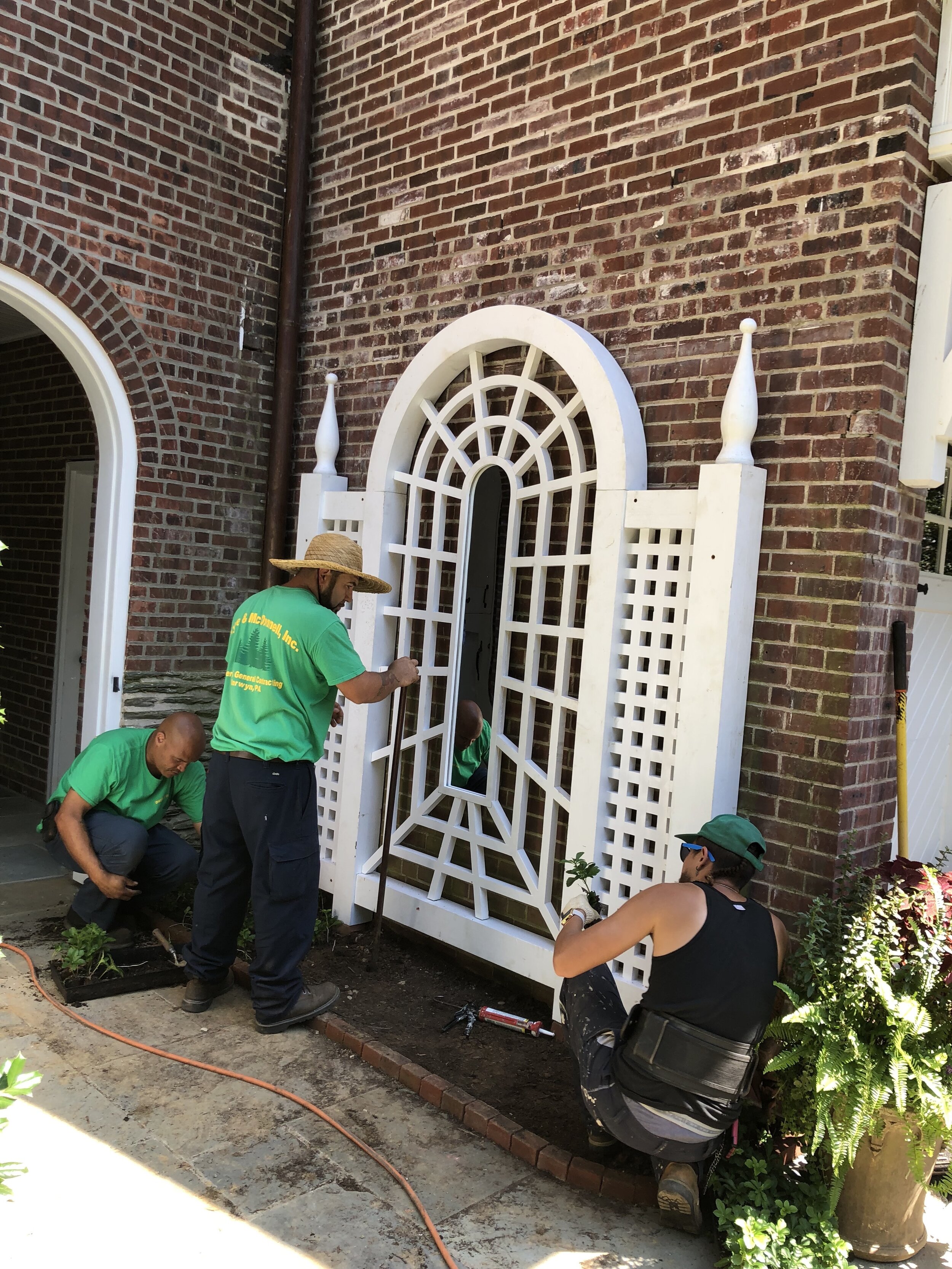  A few extra hands from Doyle &amp; McDonnell, Inc made all the difference in getting the pergola into its final position. 