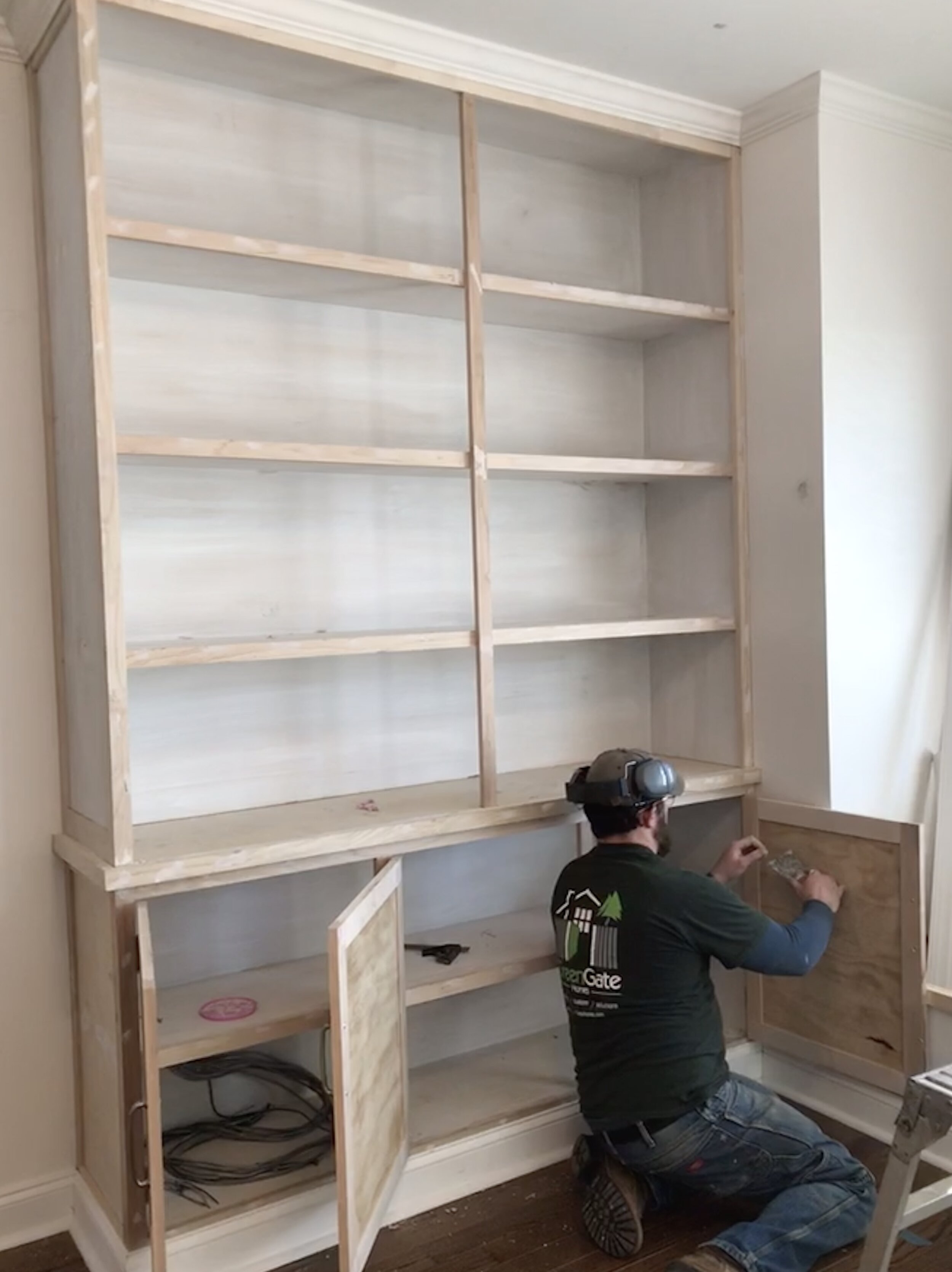  Since I do all my own work, and work alone, photos of me working are somewhat few and far between. The client took this one of me while I was filling nail holes after fitting the cabinet doors.  