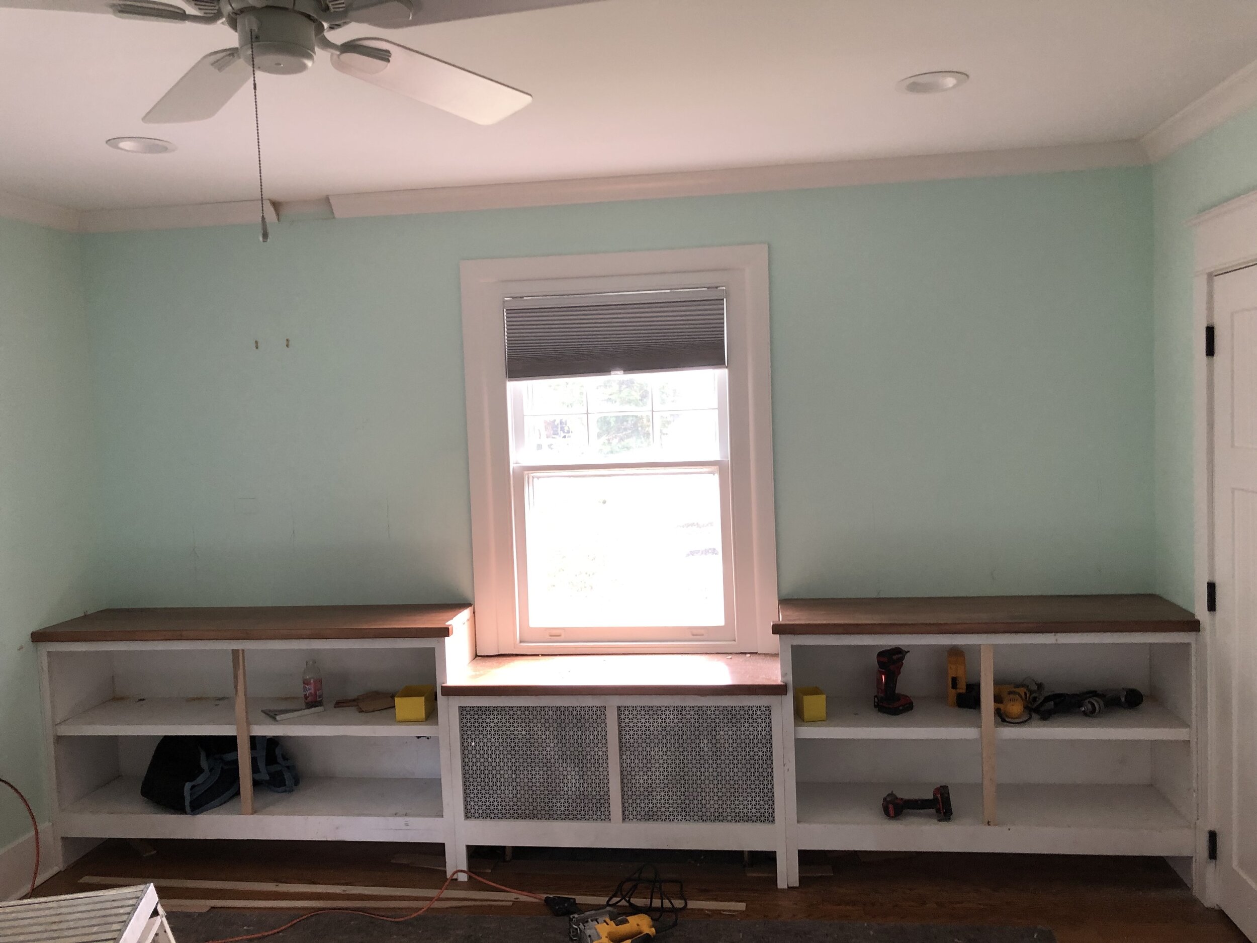  Here, the face frames have been installed, along with the new radiator cover and maple countertops. 