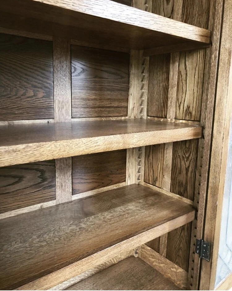I opted to go with a sawtooth adjustable shelf system to maintain the antique character of the piece.