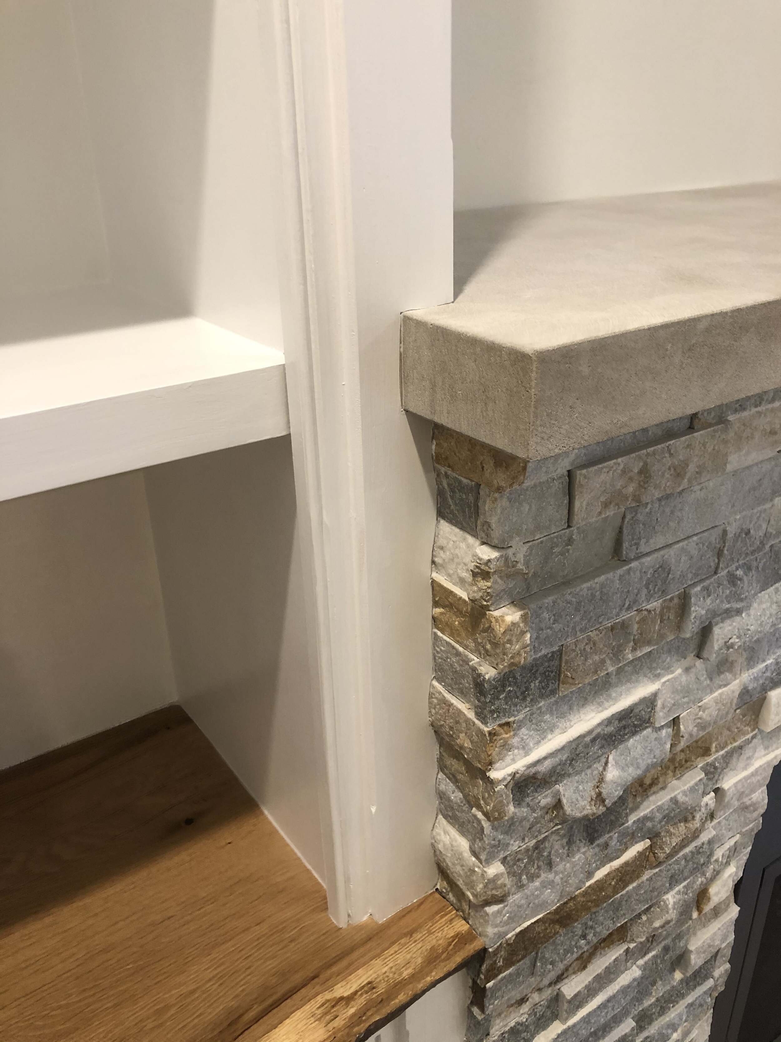  The columns were scribed to fit exactly against the existing fireplace stone.   