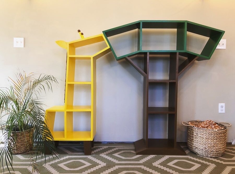  This was a set of giraffe and tree bookshelves I made as part of a fundraiser for my daughter’s nursery school. The pair of bookshelves fit together to show a hungry giraffe nibbling on a tree. For smaller spaces, the bookshelves can be displayed ap