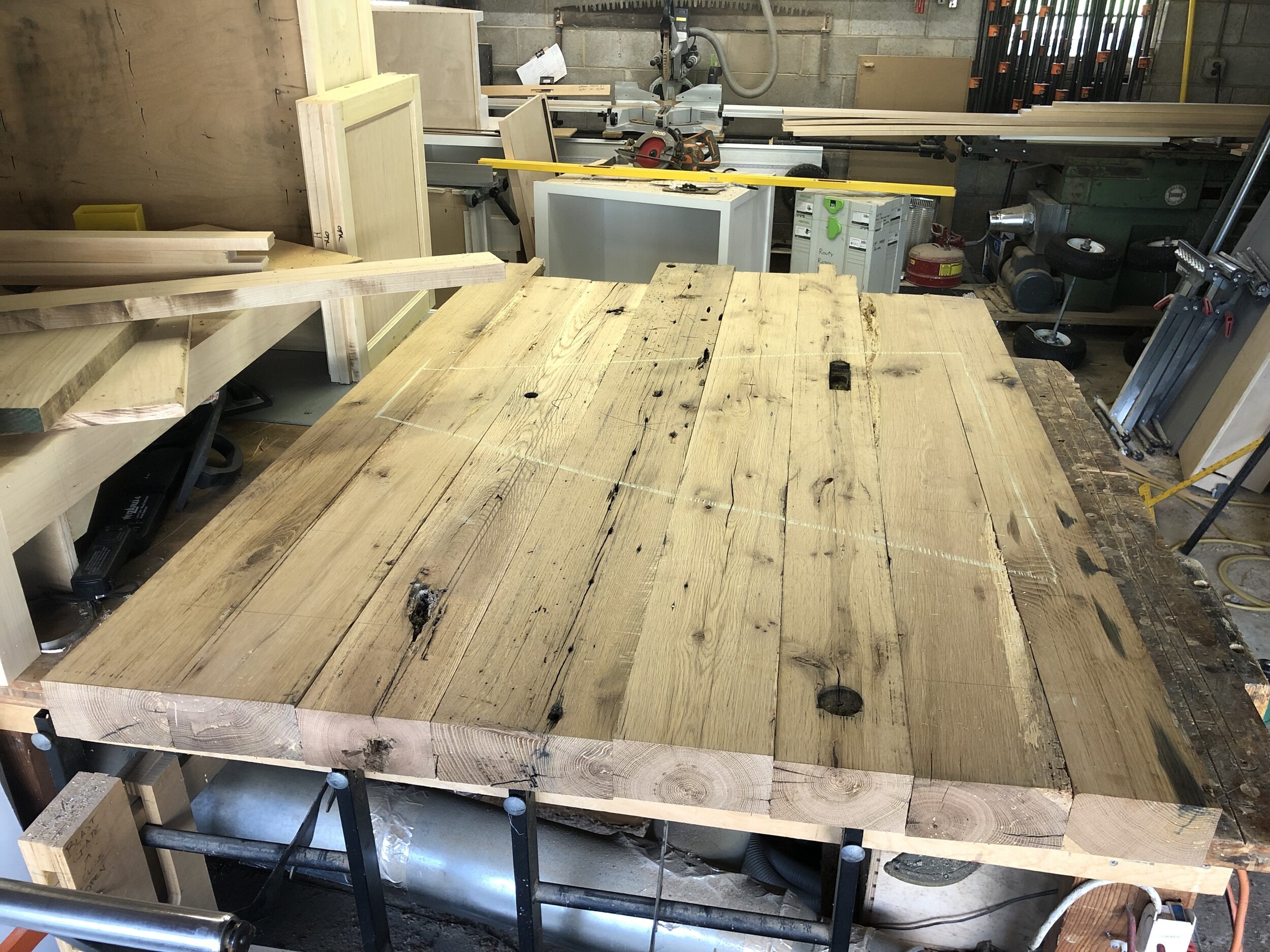  A client asked me to make them a peninsula for their kitchen, with a wooden top made from some of the reclaimed barn beams I had in stock at my shop. The countertop is 3” thick, and approximately 48” wide by 60” long. 