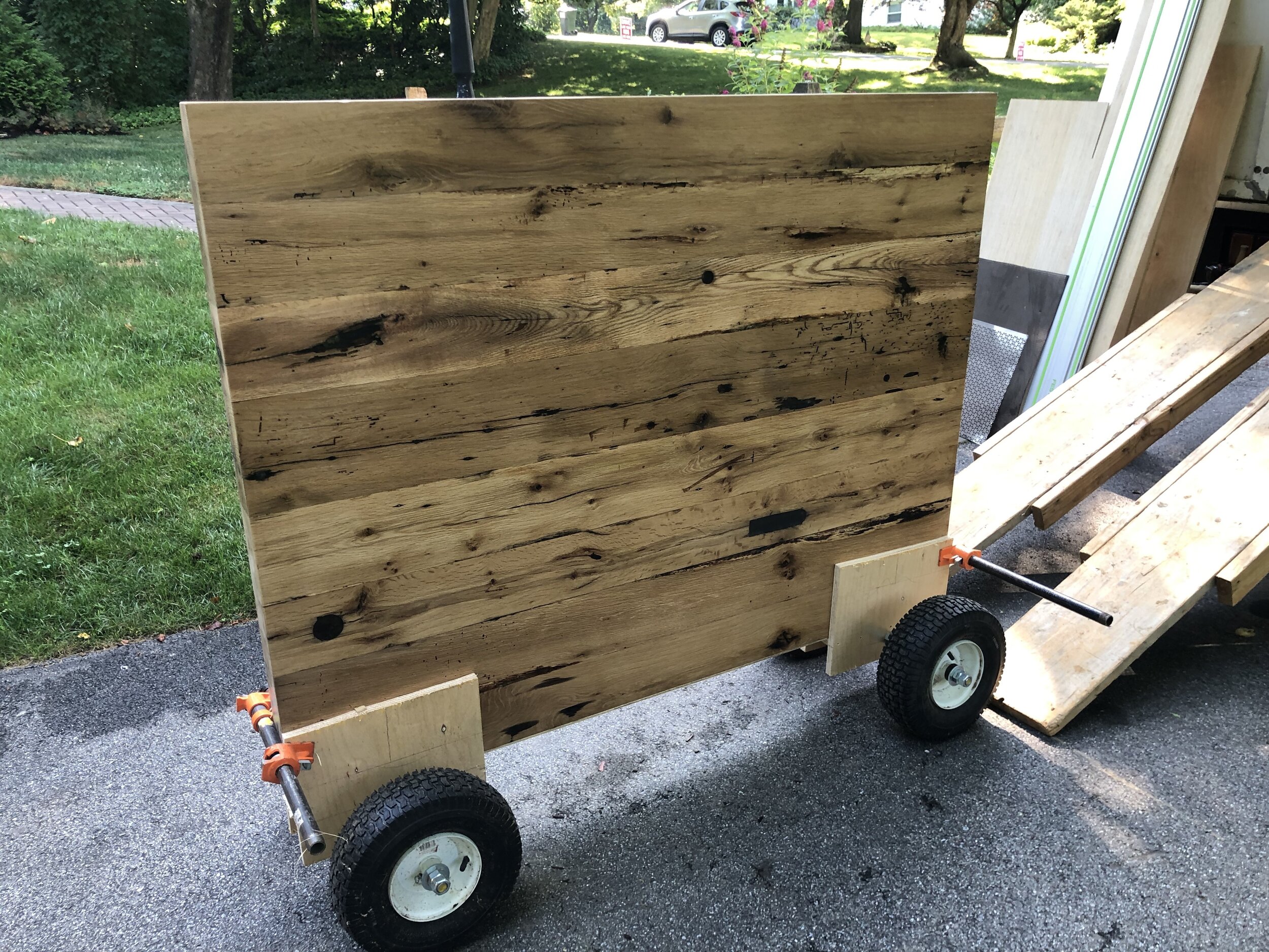  This countertop was extremely heavy, and since I work alone I had to come up with a way to safely move it into the house. Using some pneumatic wagon wheels I had leftover from another project, I put together some quick dollies to make my life a litt