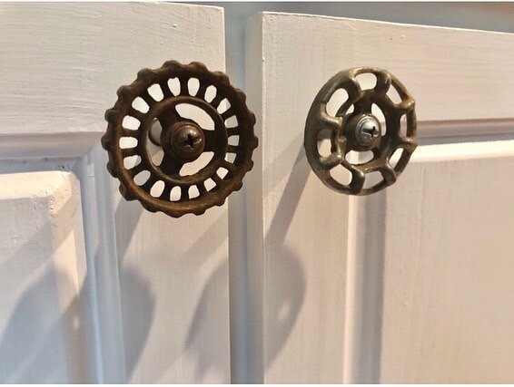  The pulls for the cabinet doors were made from old spigot handles the client had salvaged from their family farm. I added new hardware and custom spacers to make them function like standard cabinet handles.  