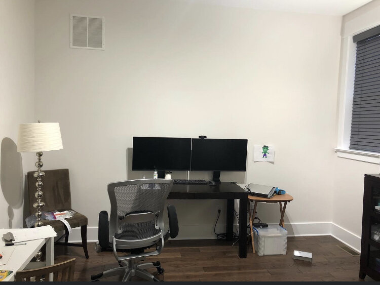  This project came to me from two clients who were looking to maximize the use they could get out of their existing home office. The original setup shown here only allowed for one person to work in the room. They had in mind a large T-shaped desk whi