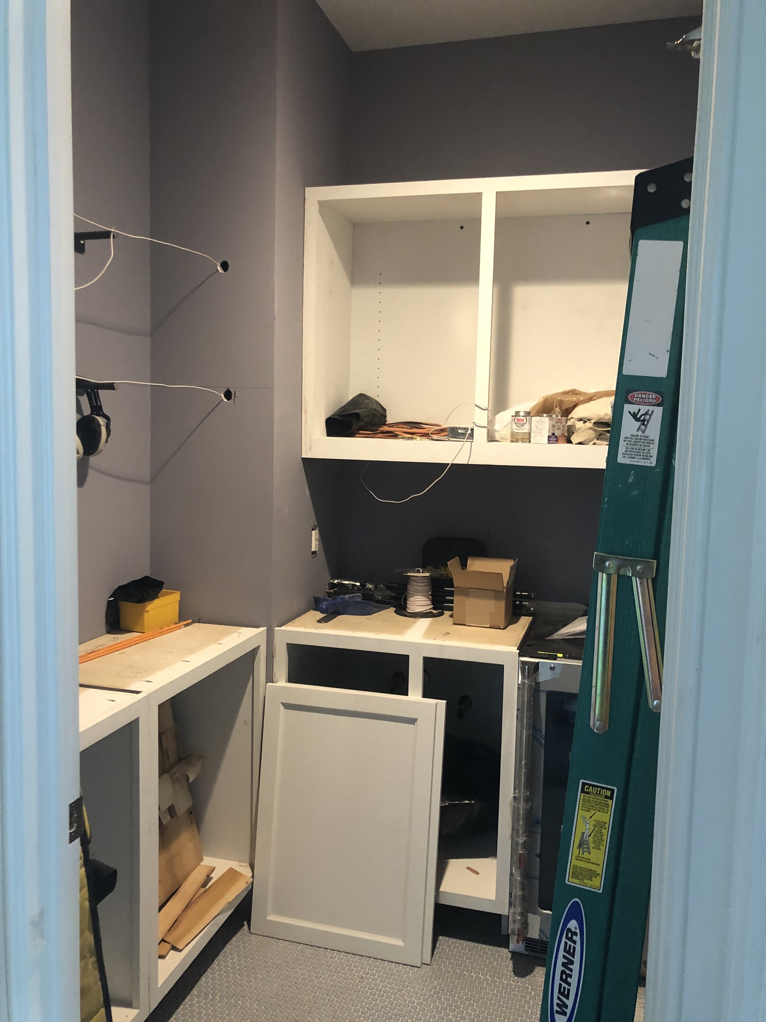  This room was originally a powder room, but the client wanted to change it to a walk-in pantry instead. After other contractors were done removing some of the original plumbing and installing the new tile floor, I came in to start on my work. Here y