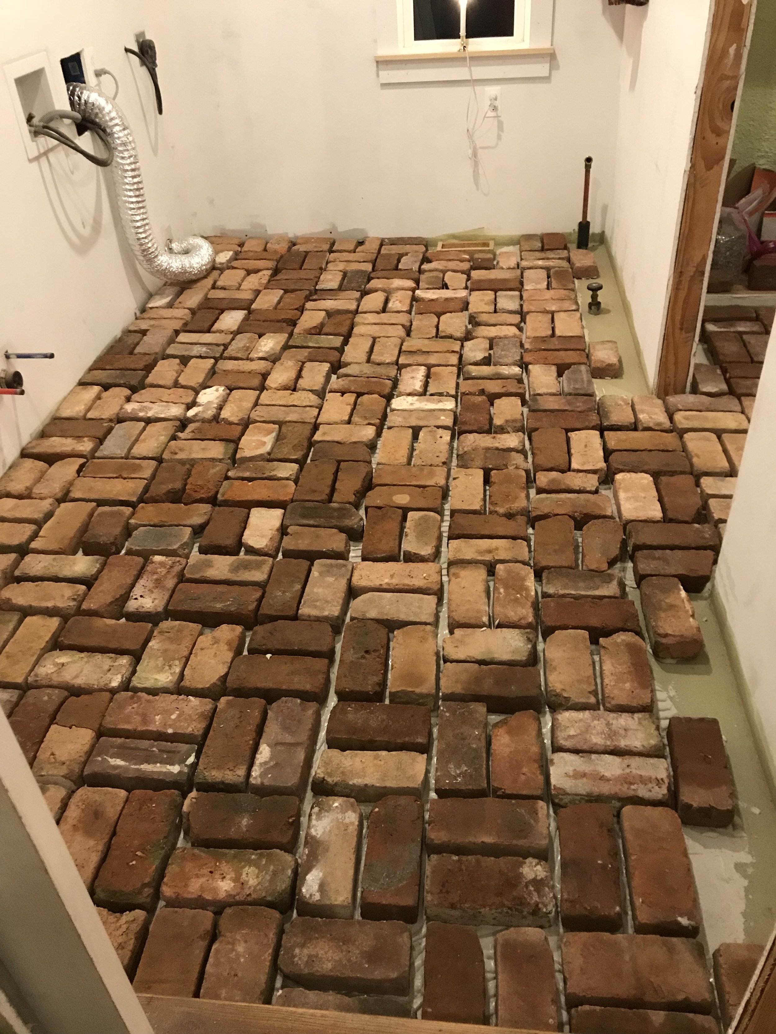  Next up was installing the reclaimed bricks in a basketweave pattern. 
