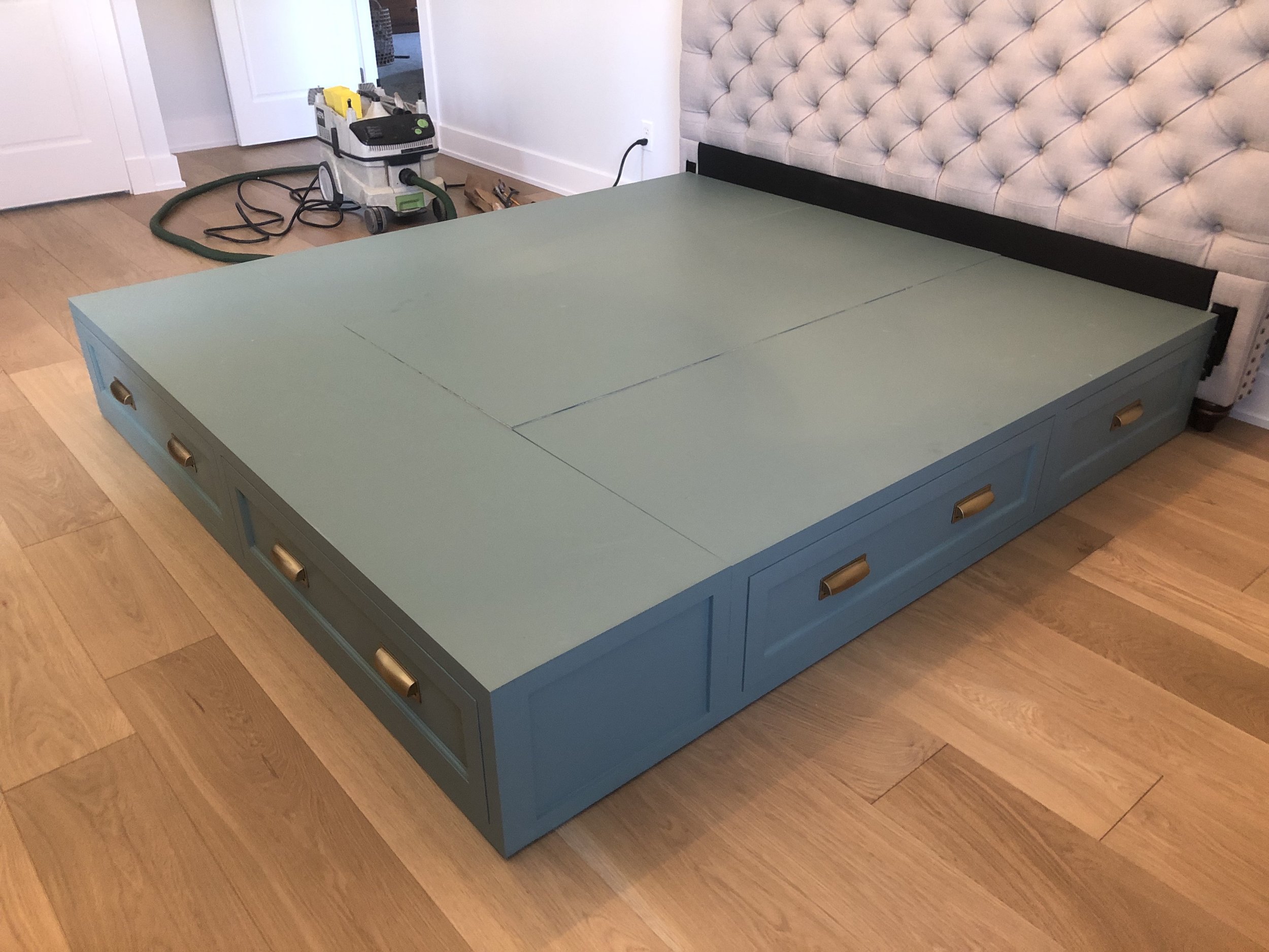 As part of  this  project, the client asked me to also create a storage platform for under their bed. For some reason I didn’t get any photos during the construction phase, the only ones I have start with this one taken during installation. The plat