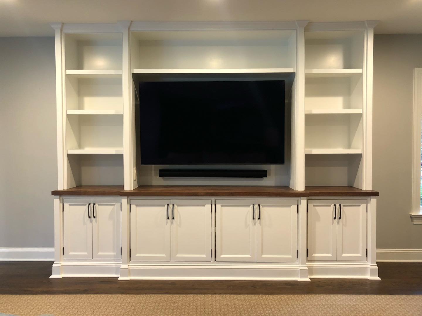 The finished project has inset flat-panel beveled shaker doors, beaded face frames, and a black walnut countertop.  