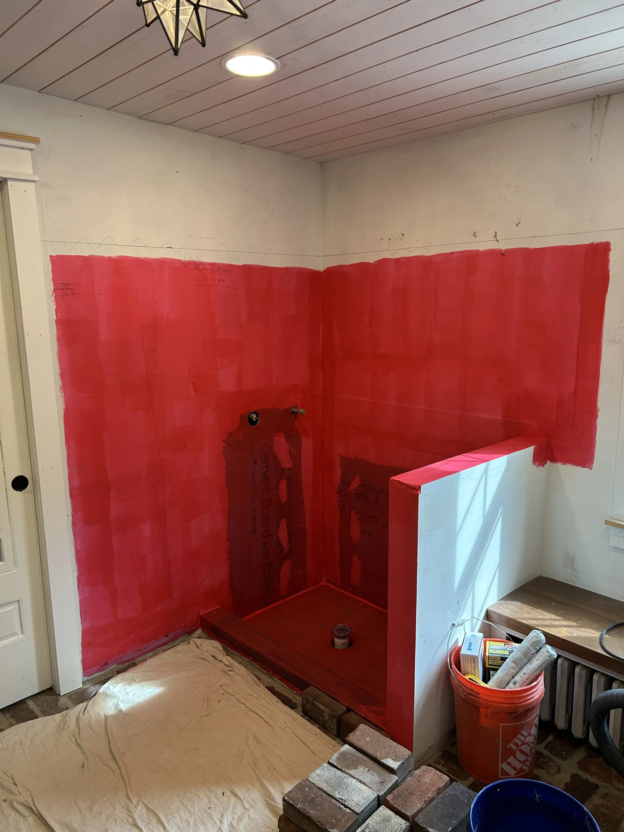  A few years back I had installed brick floors in our mudroom along with  lockers, cubbies, and a small bench , but the room remained unfinished for a while. In 2025 I was finally able to finish it up. The first step was to waterproof the dog shower 