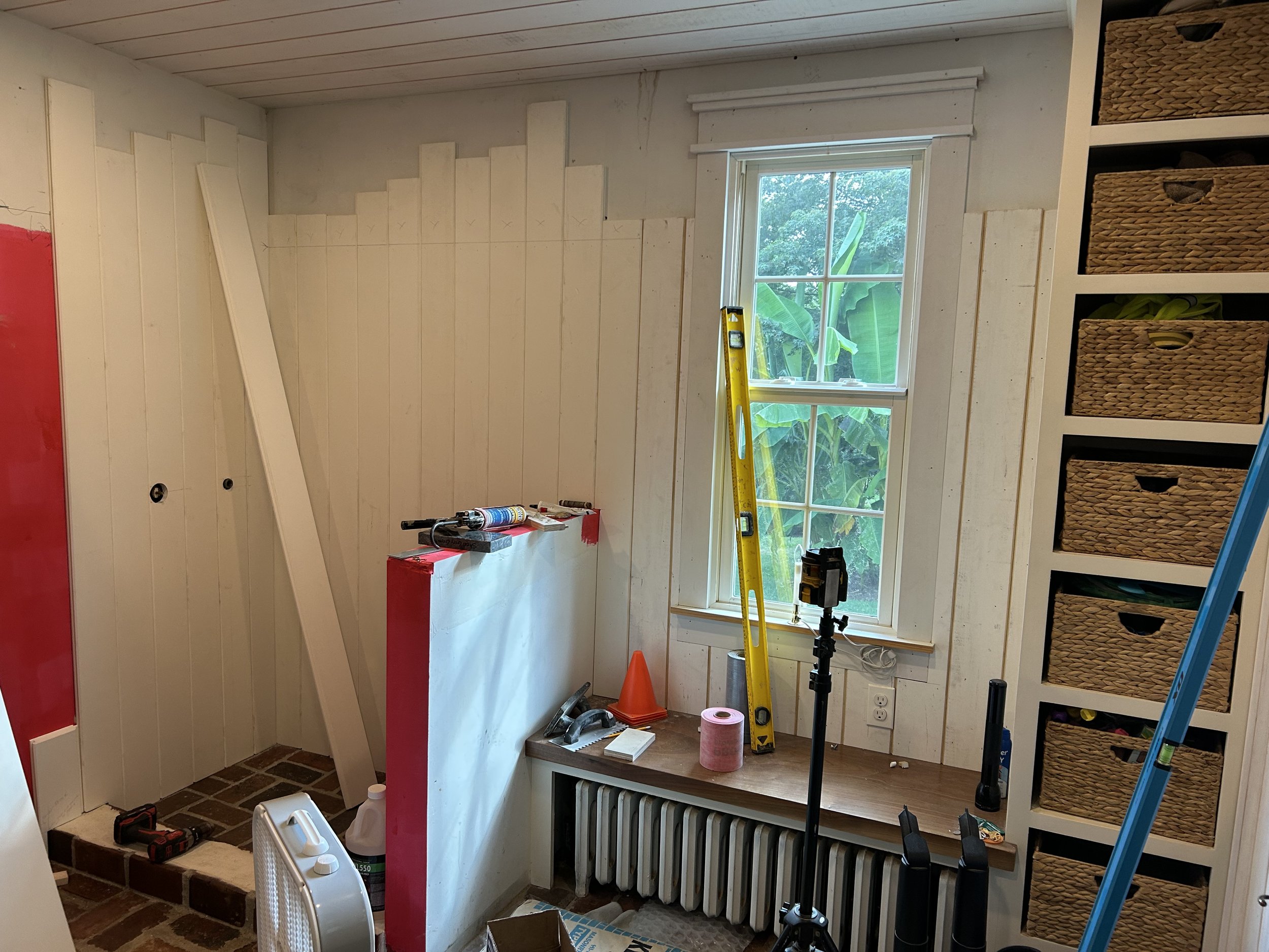  For the walls we wanted to do a tall wainscoting. Since the dog shower would obviously have to deal with moisture, I made the wainscoting in that area out of Azek (PVC boards), so that it would be completely rot proof. All joints in that area were s