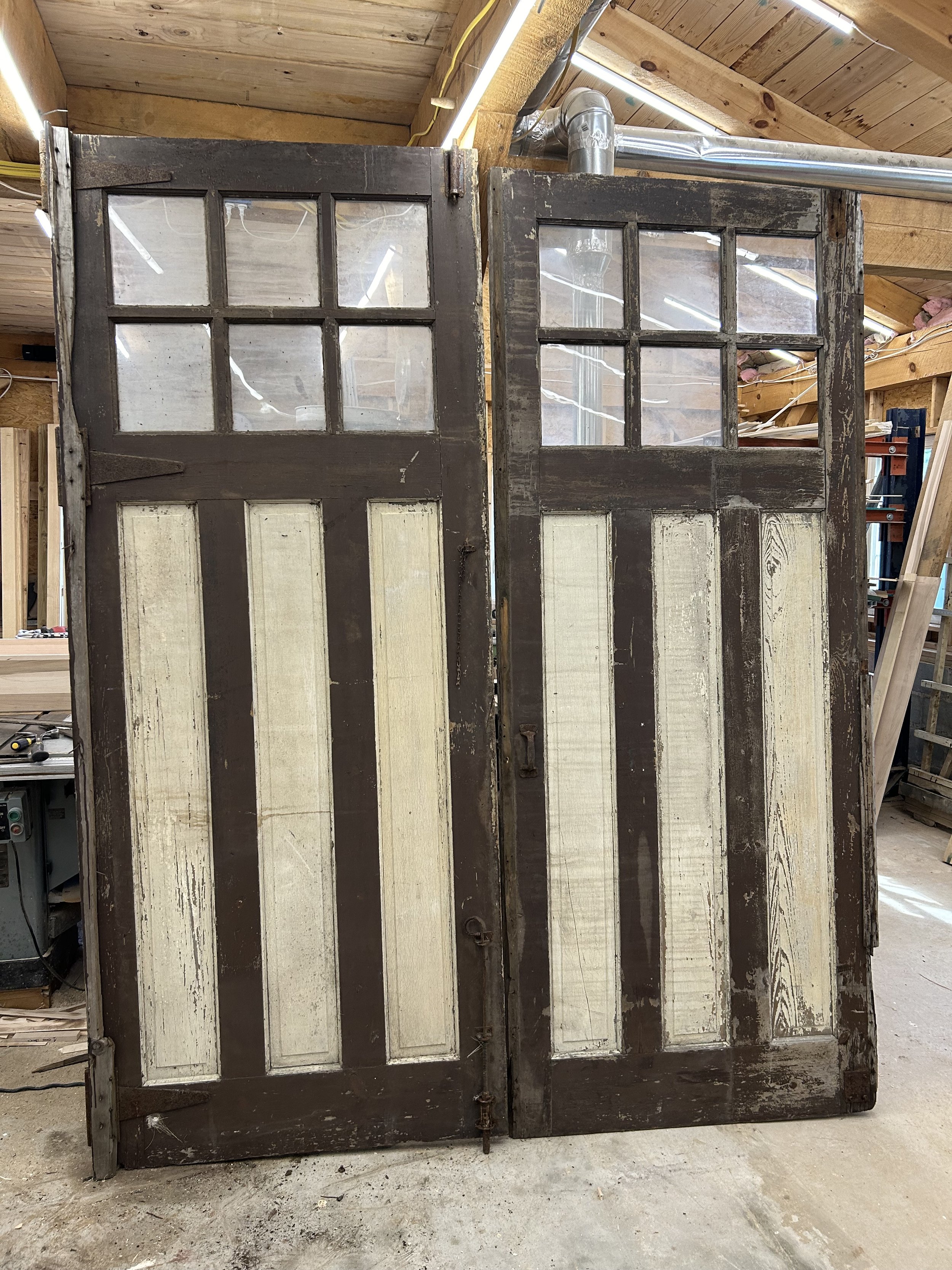  To replace the temporary set of front doors I had made, I found these reclaimed doors that were the perfect width for what I needed but were around a foot too tall.  