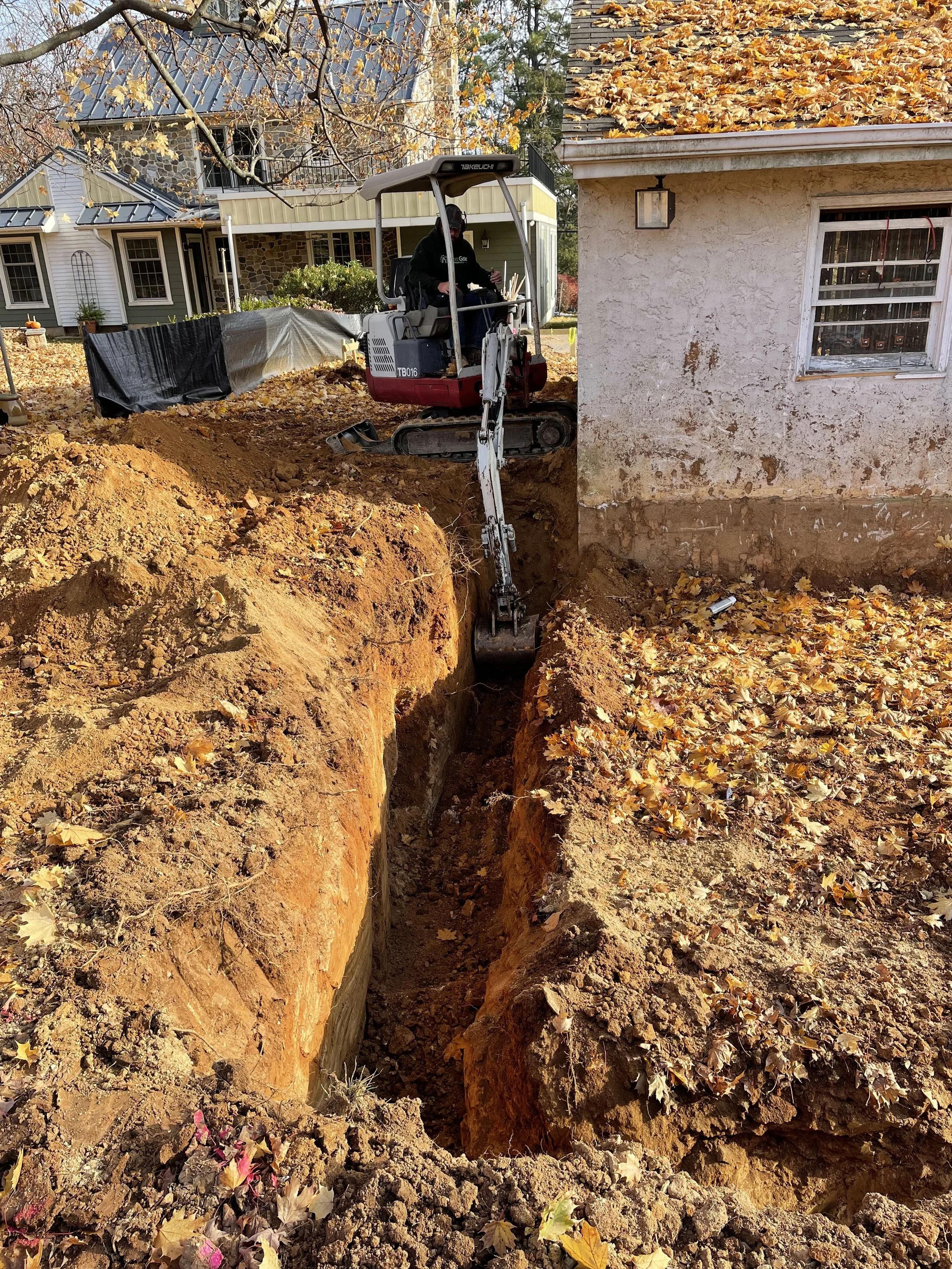  For the footers I had to rent a mini excavator that allowed me to dig deeper and closer to the original building than my tractor could.  