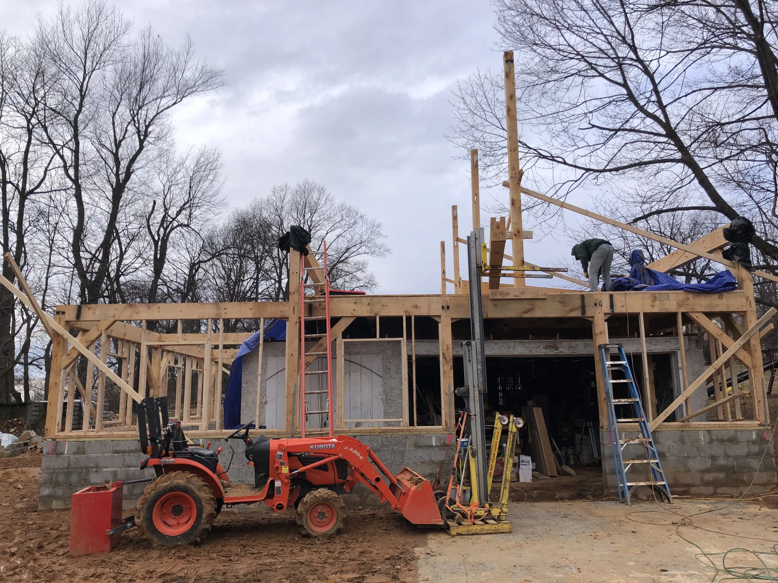  Here you can see the main posts for the roof going in. We used the material lift to load all our necessary materials up to the second floor before dismantling the lift and moving it up there as well.  