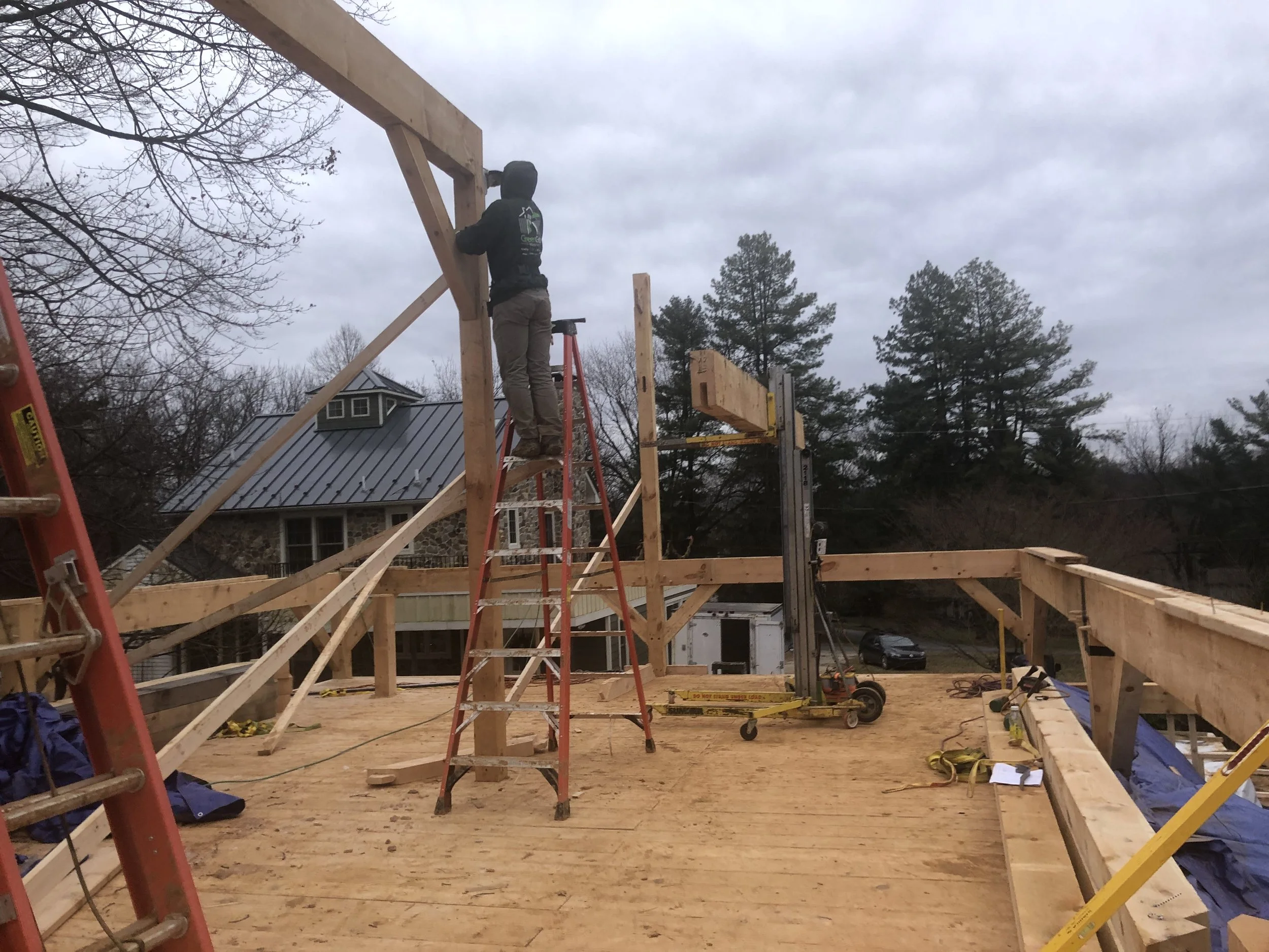  With the material lift on the second floor, we began setting the ridge beam sections.  