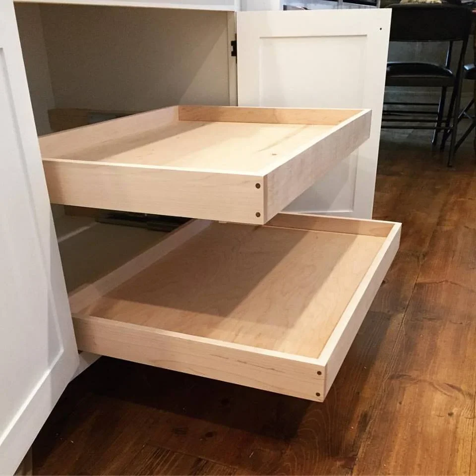  These are the pull-out shelves my daughter was sitting on in the last picture. Typically I make my drawers with dovetail joinery, but in this case I wanted to do something different, so I made them from solid maple with a housed rabbet joint in each