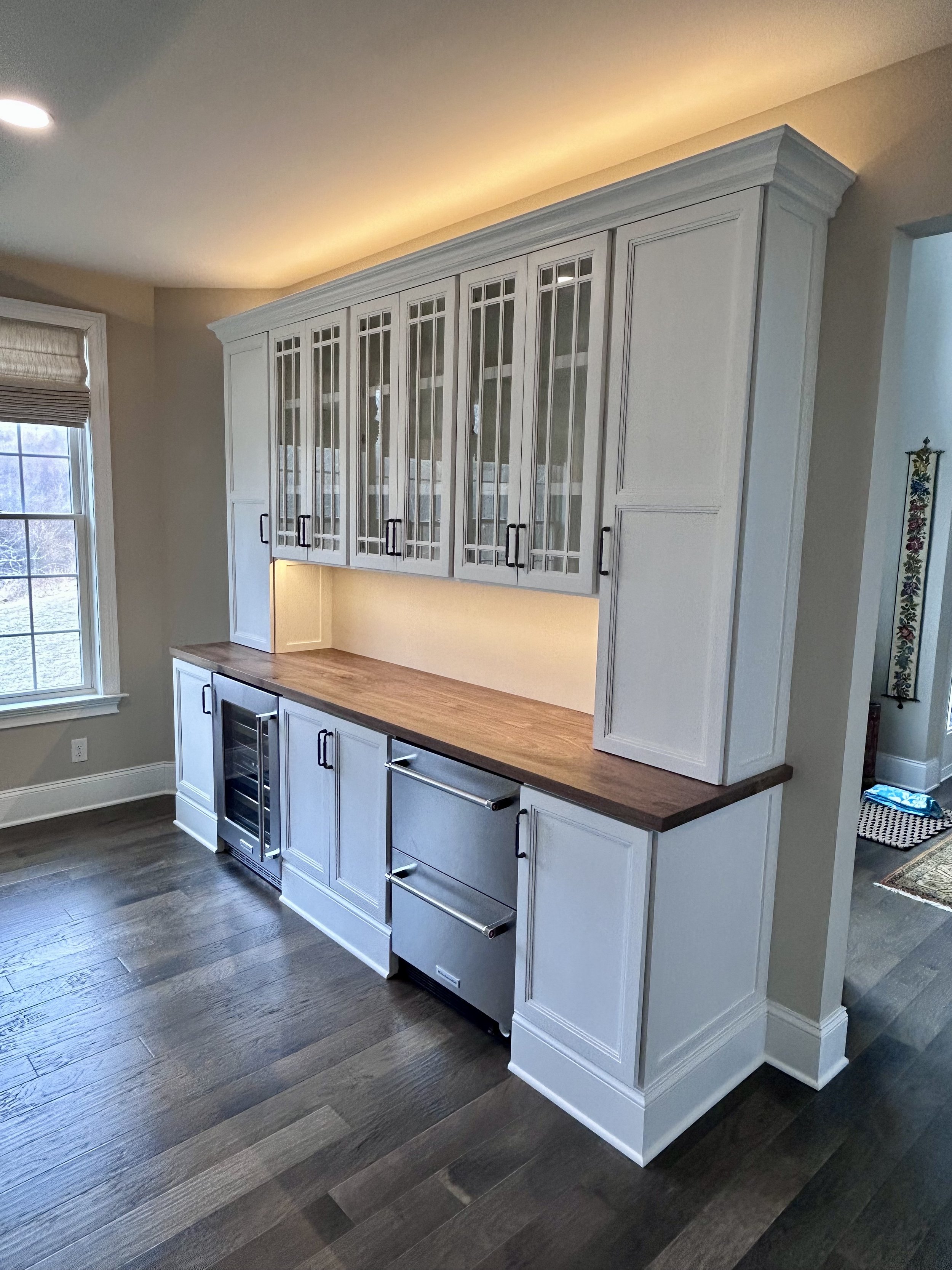  Under-cabinet lighting illuminates the black walnut countertop, and the LED lights on top create a nice ambient glow. I also replaced the existing kitchen cabinet lights with new LEDs, so all lighting is uniform in color.  