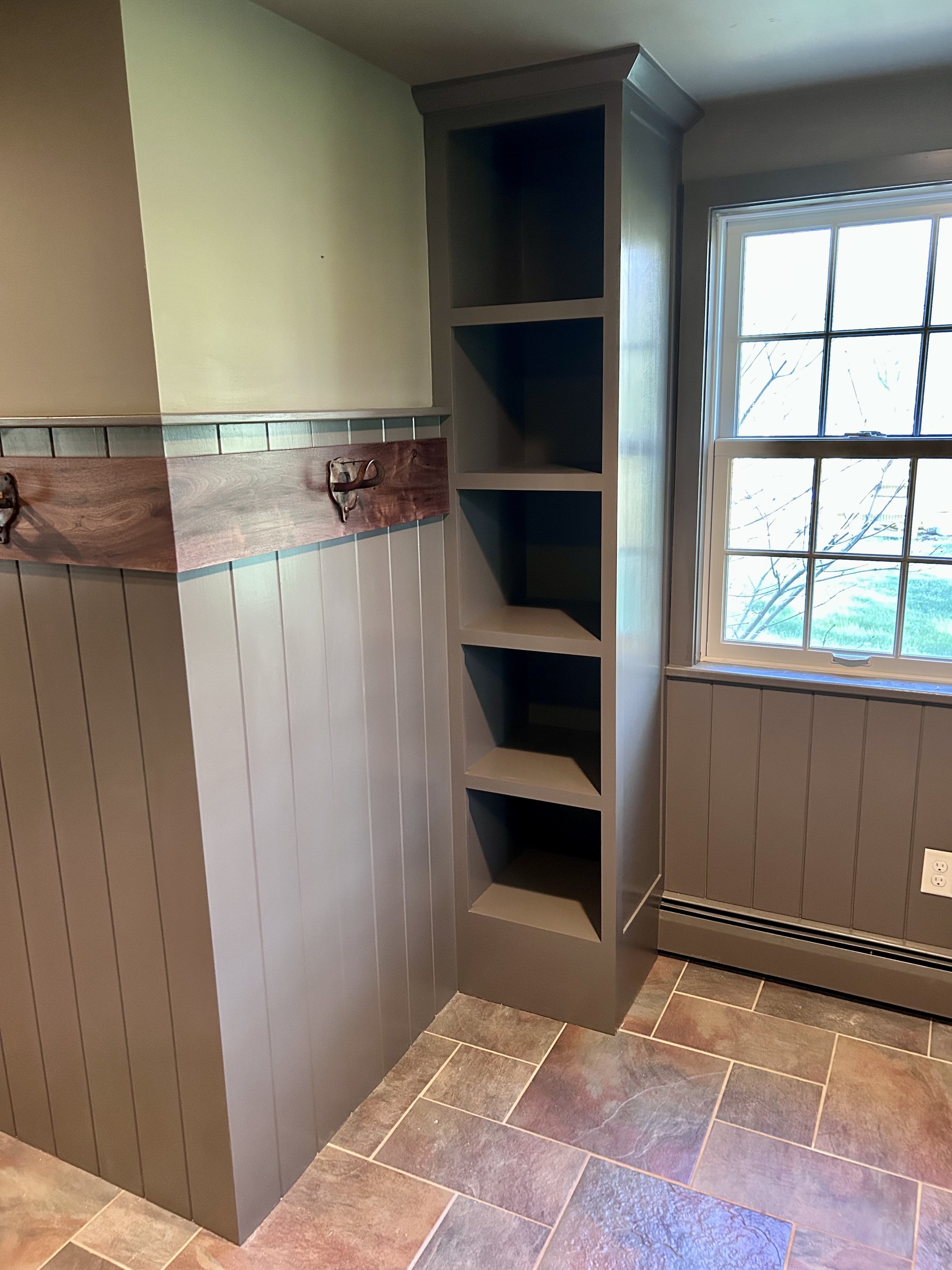  Custom wainscoting ties the various sections of the room together. 