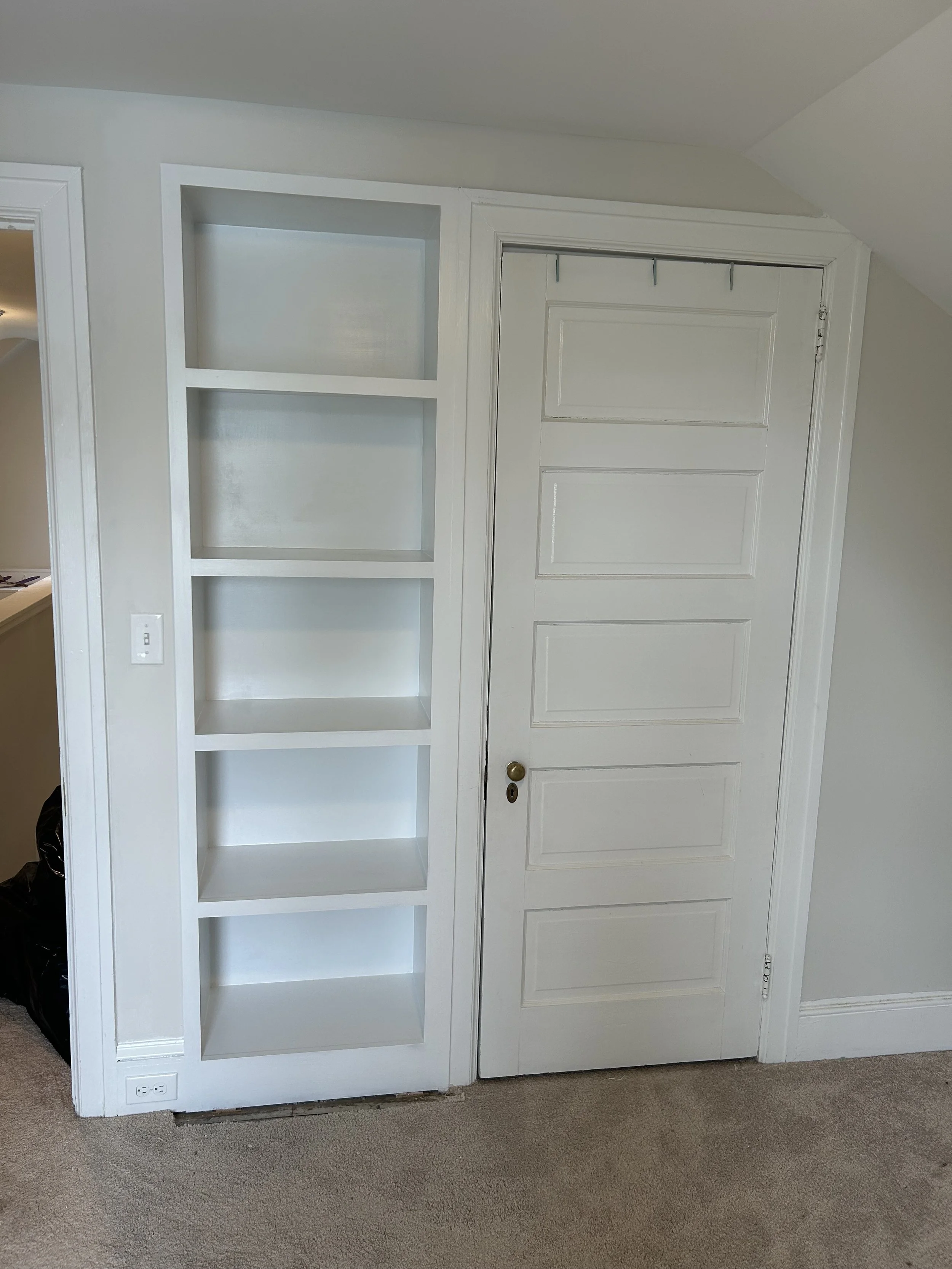  This recessed bookshelf was added along side an existing closet.  