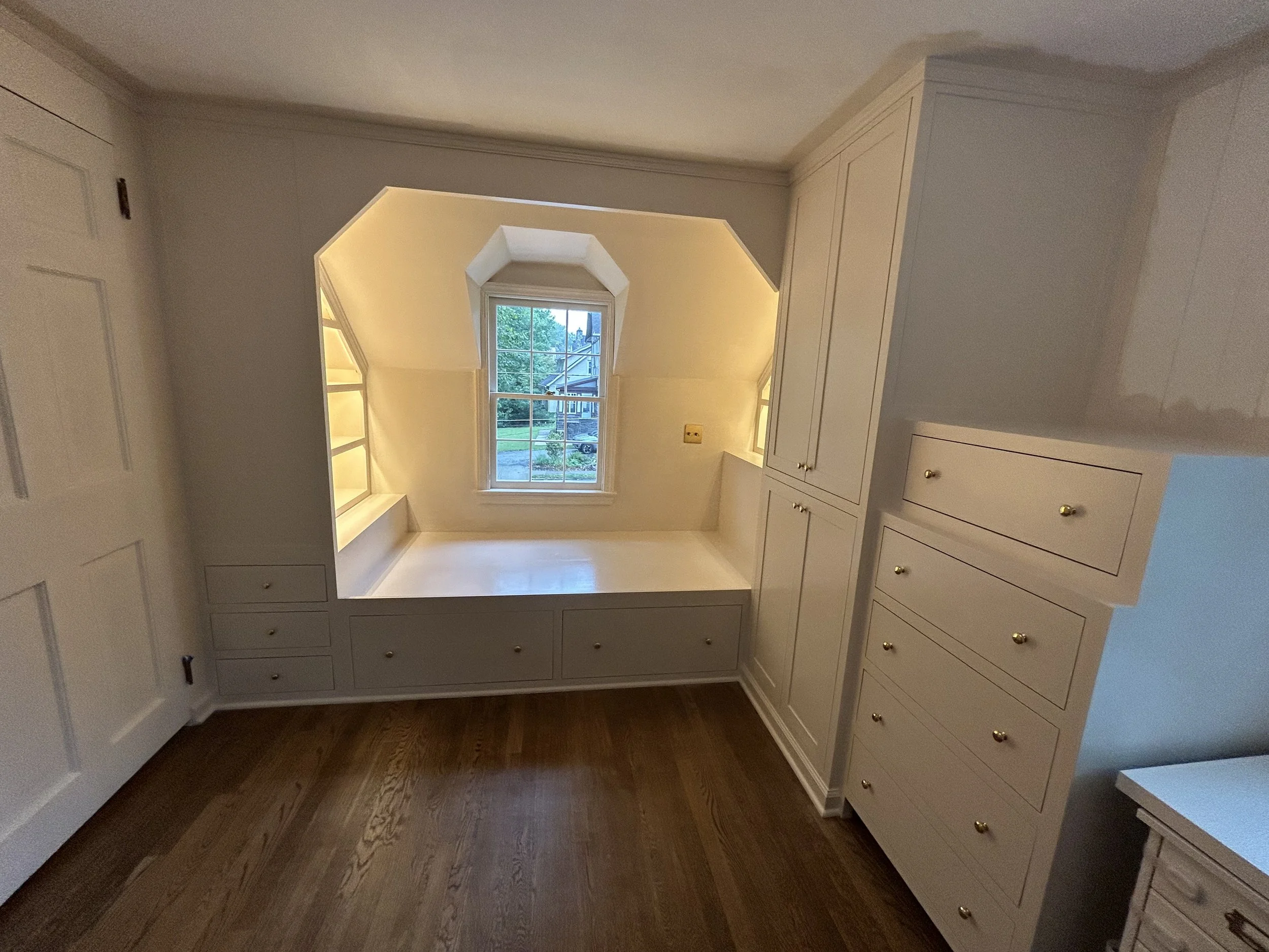  Undershelf LED lights in both sets of bookshelves create a soft light for reading.   