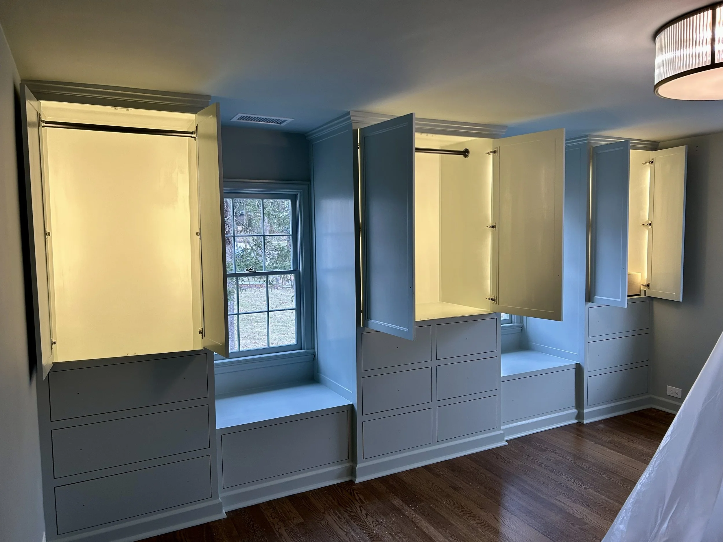  All three closets have LED lights inside controlled by a motion sensing dimmer in the ceiling, which illuminates the hanging areas when the doors are opened.  