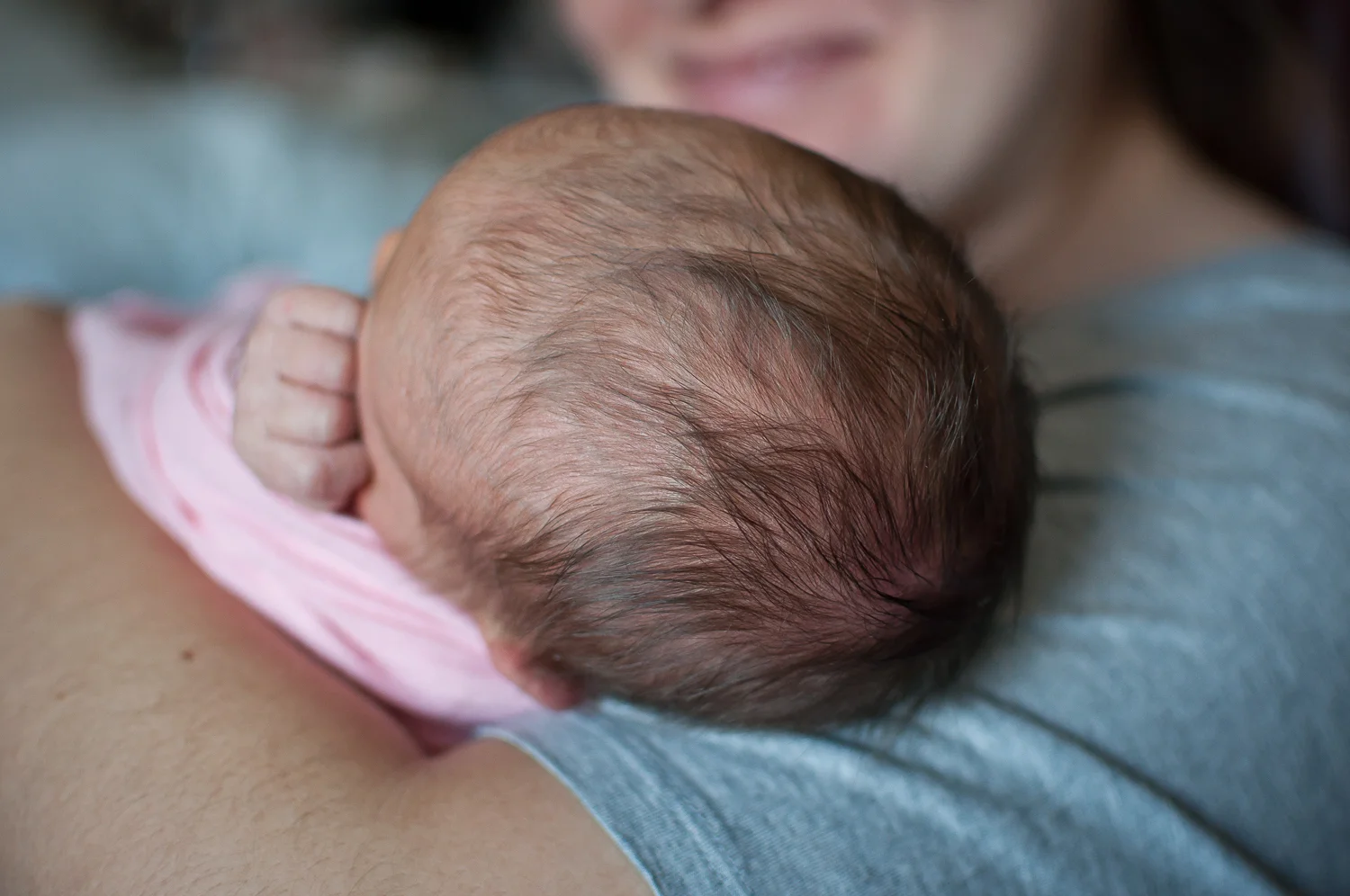 Newborn's hair featured in mother and baby photograph from a fesh 48 session in Pekin IL