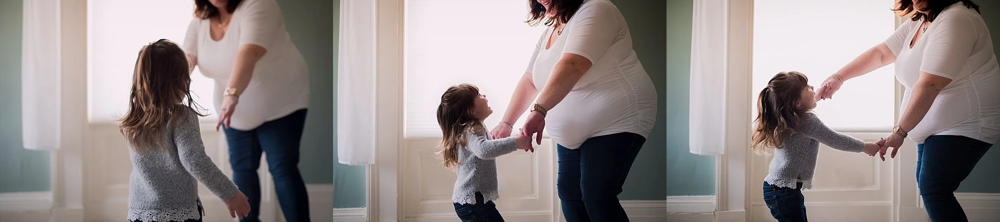 Mom and daughter dance during family lifestyle session.