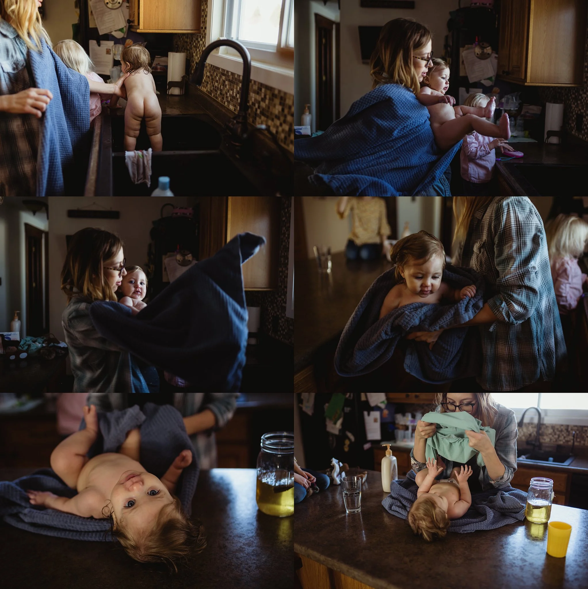 Mom lifts baby from sink after bath. Brittney Hogue photographs families and newborns in the Peoria IL area/