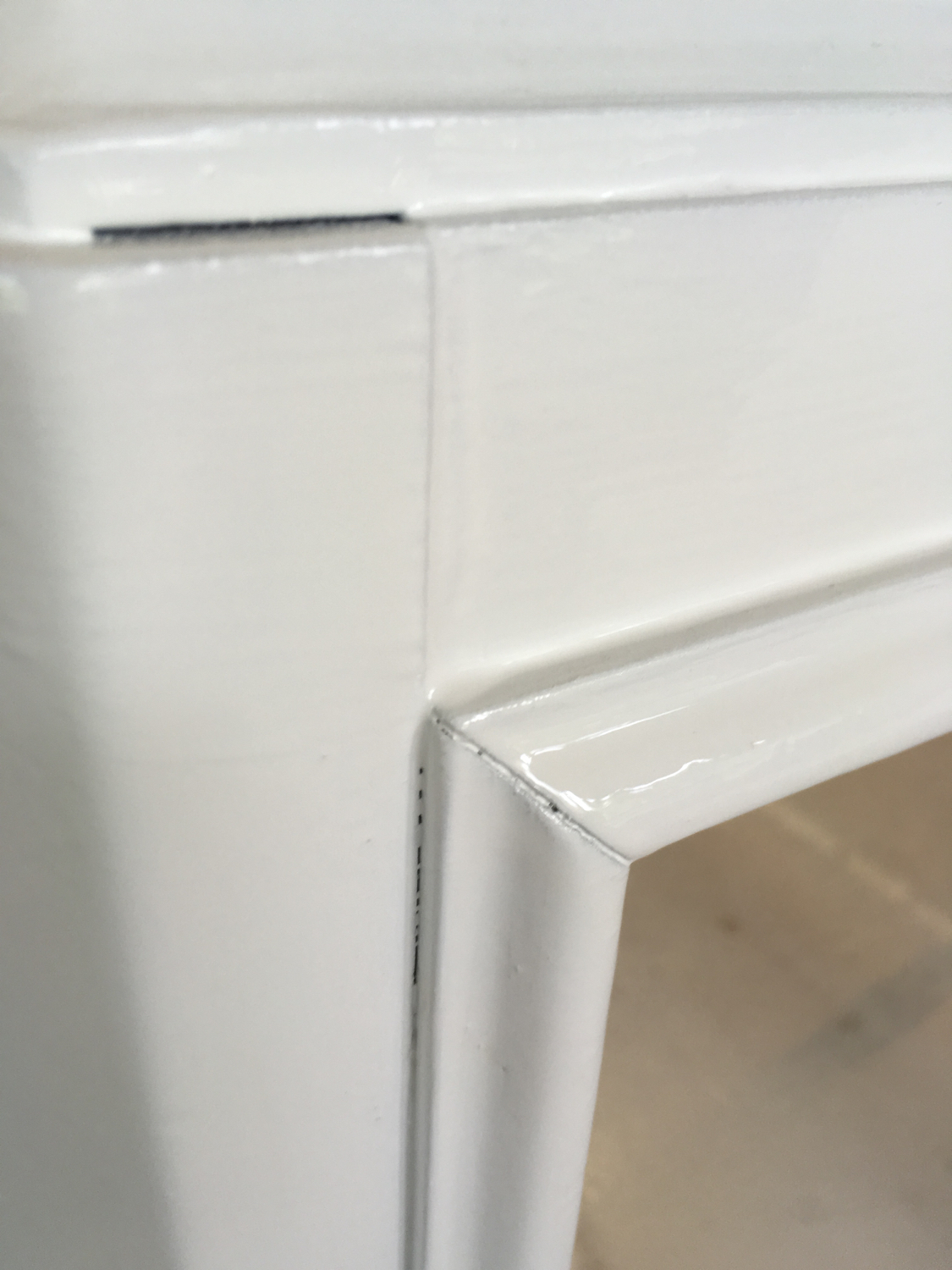 I know the miter isn't that pretty on this reclaimed coffee table base, but look how smooth that paint job is! 