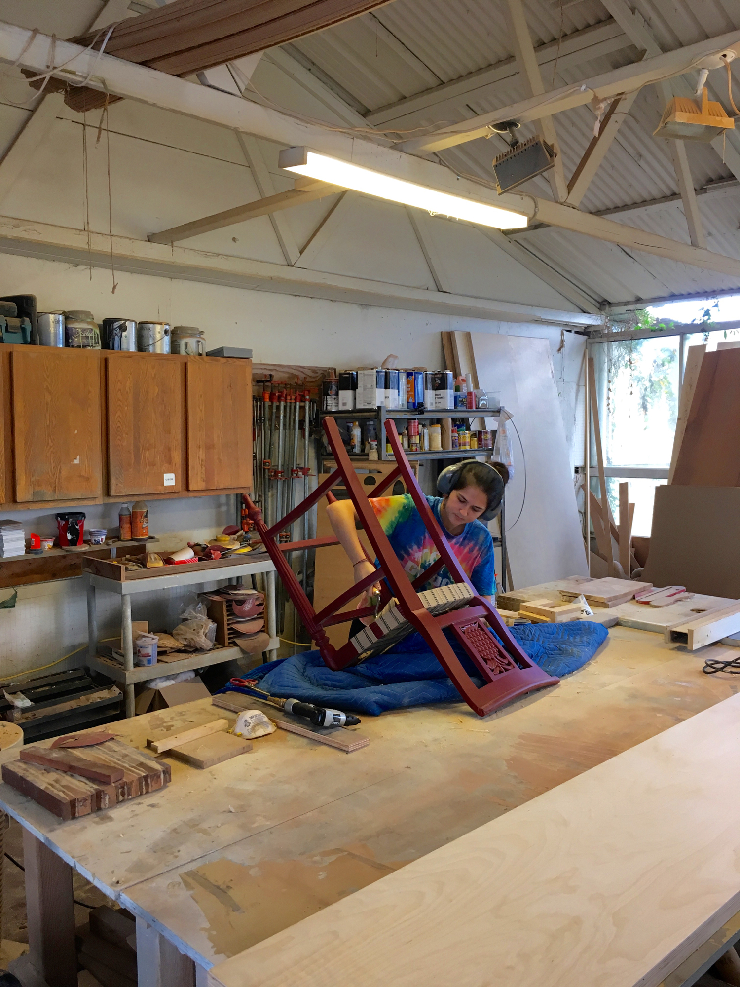  Stapling jute webbing to make a new seat for this old chair. 