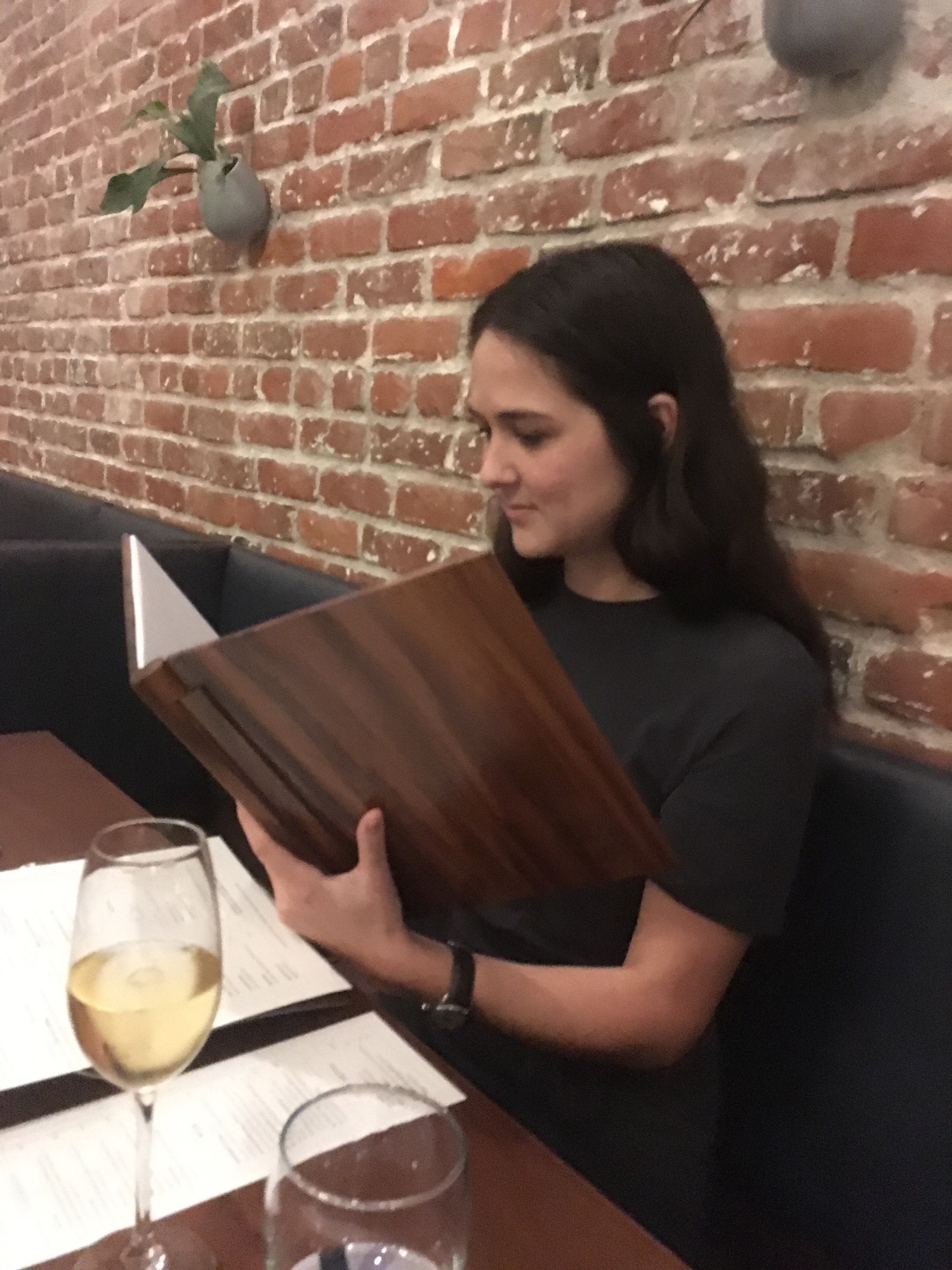 Kristina studying the wine menu