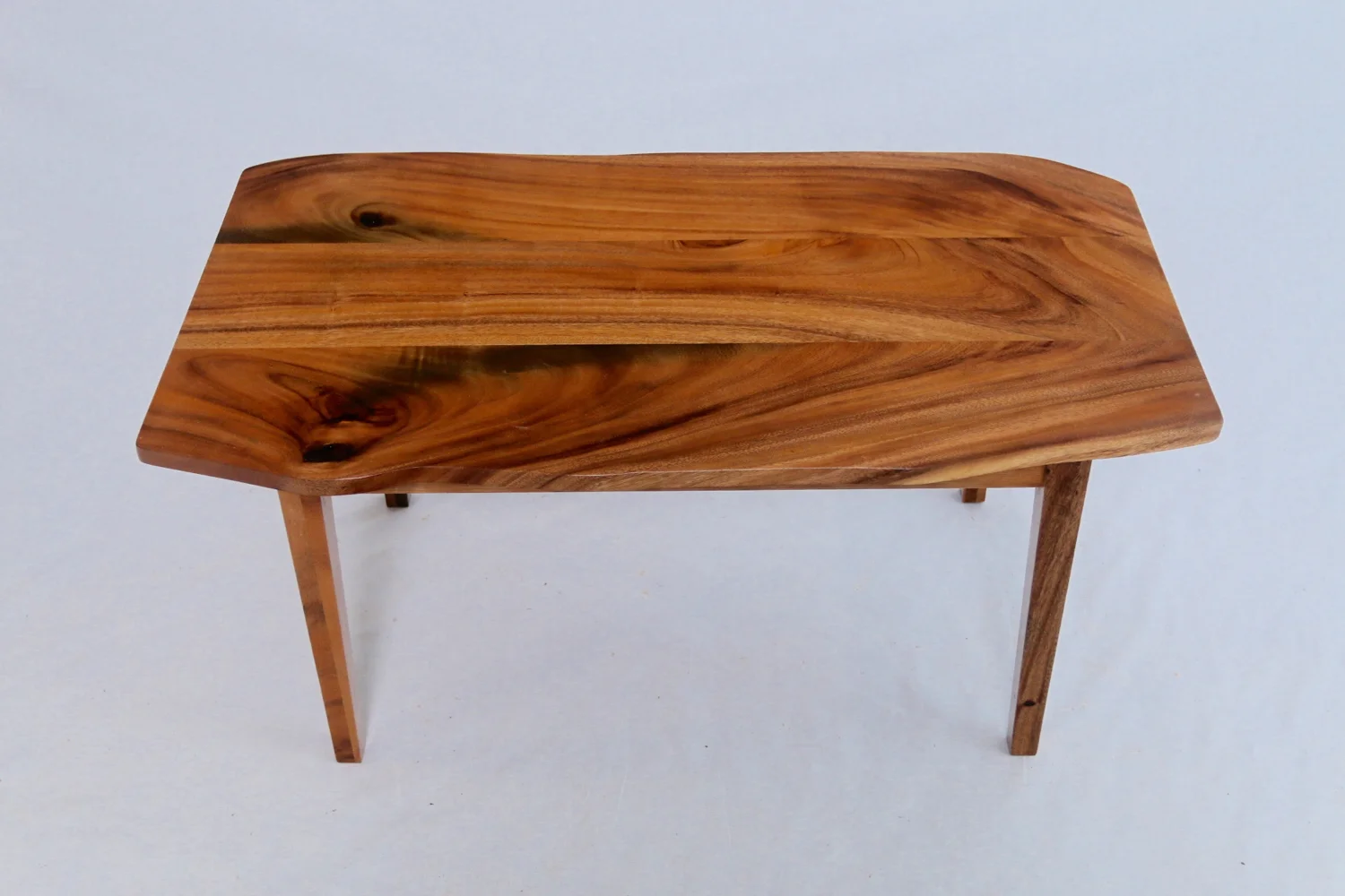 Classic simple monkeypod coffee table. Hint at a natural edge and slim tapered legs.