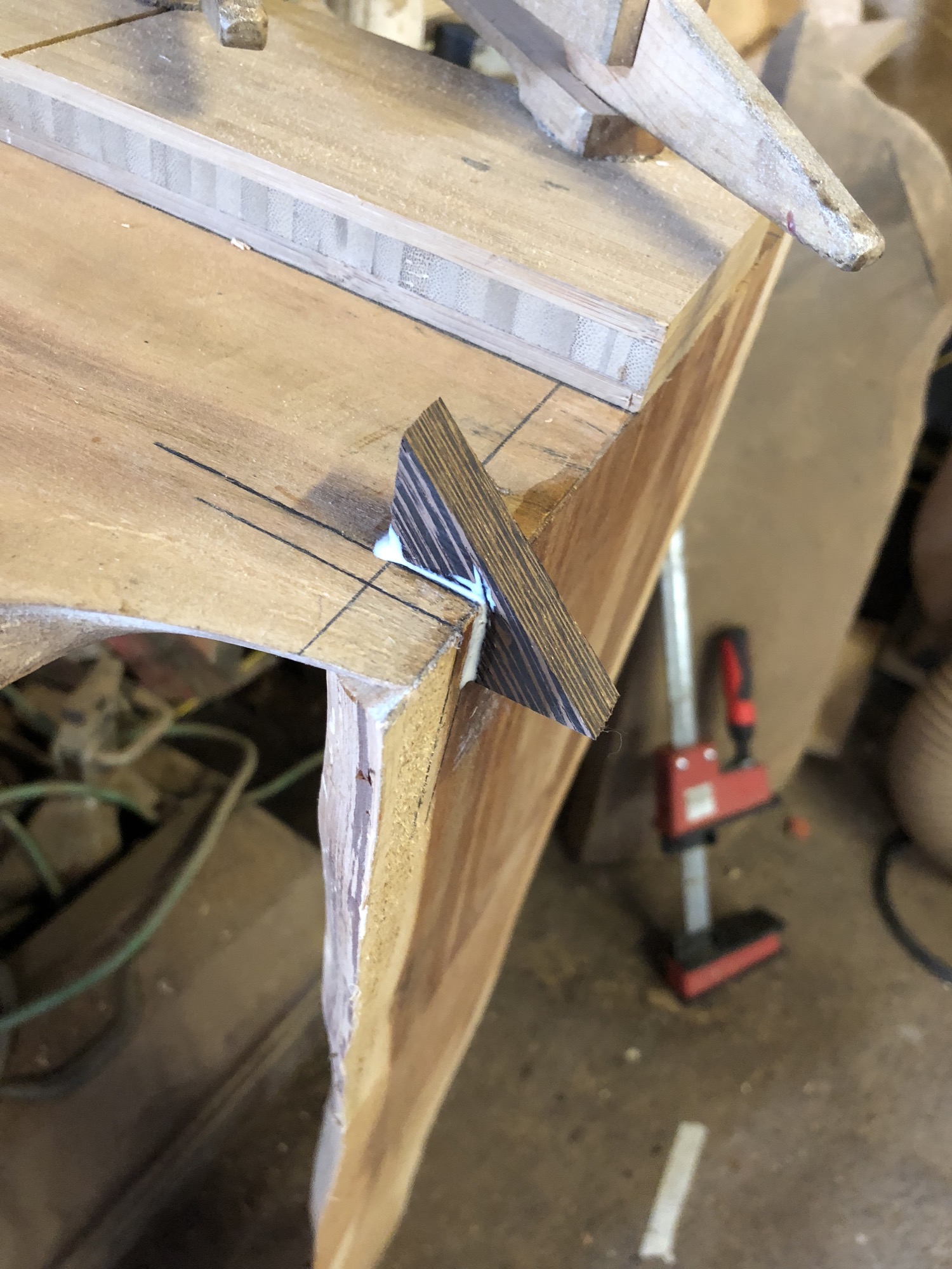  I cut a little slot, and glue the wenge spline in place. Two of these splines give this joint a huge amount of strength, and the wenge gives a nice contrast in both color and texture. 