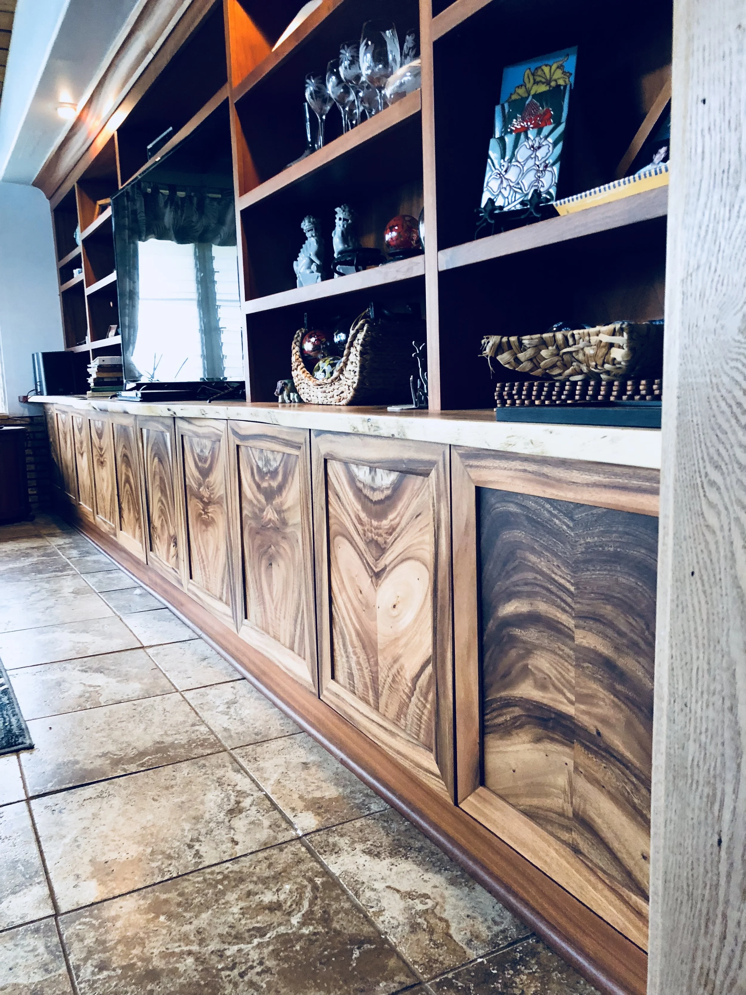 Monkeypod built in cabinet with live edge slab top. Custom built for the client's space.
