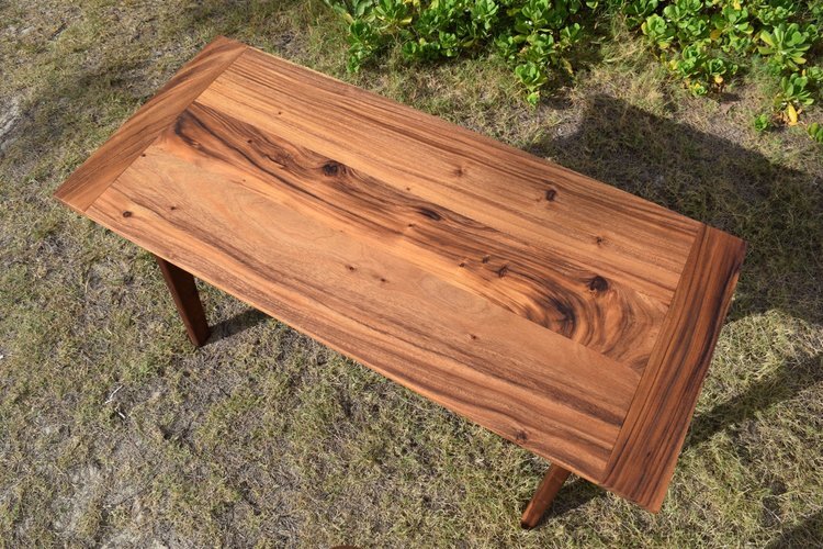 Monkeypod desk with walnut legs.