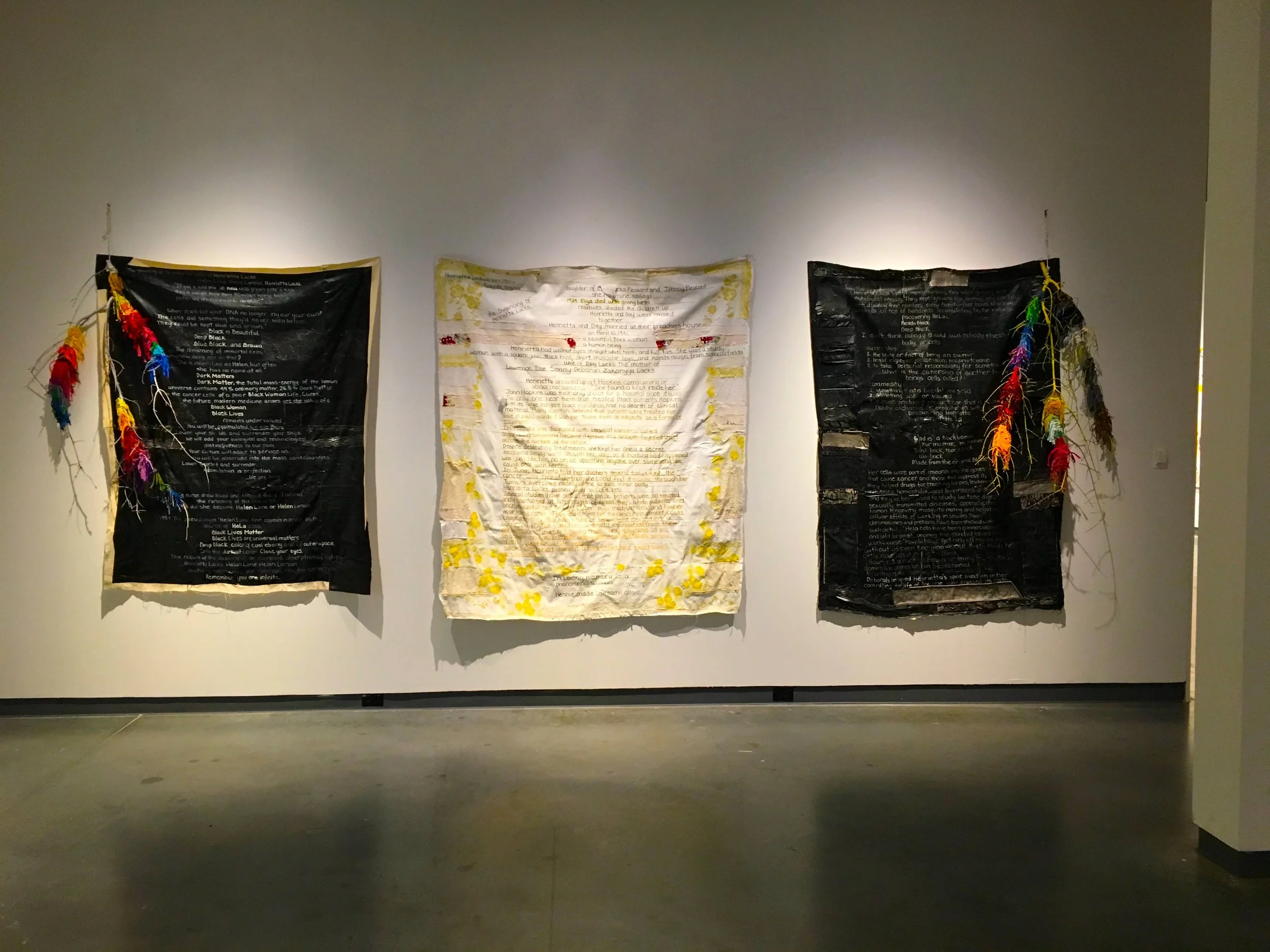 In Loving Memory of A Phenomenal Woman, (Tribute to Henrietta Lacks) Installation, Text, Assembladge on Canvas, at Delaware Contemporary, 2017