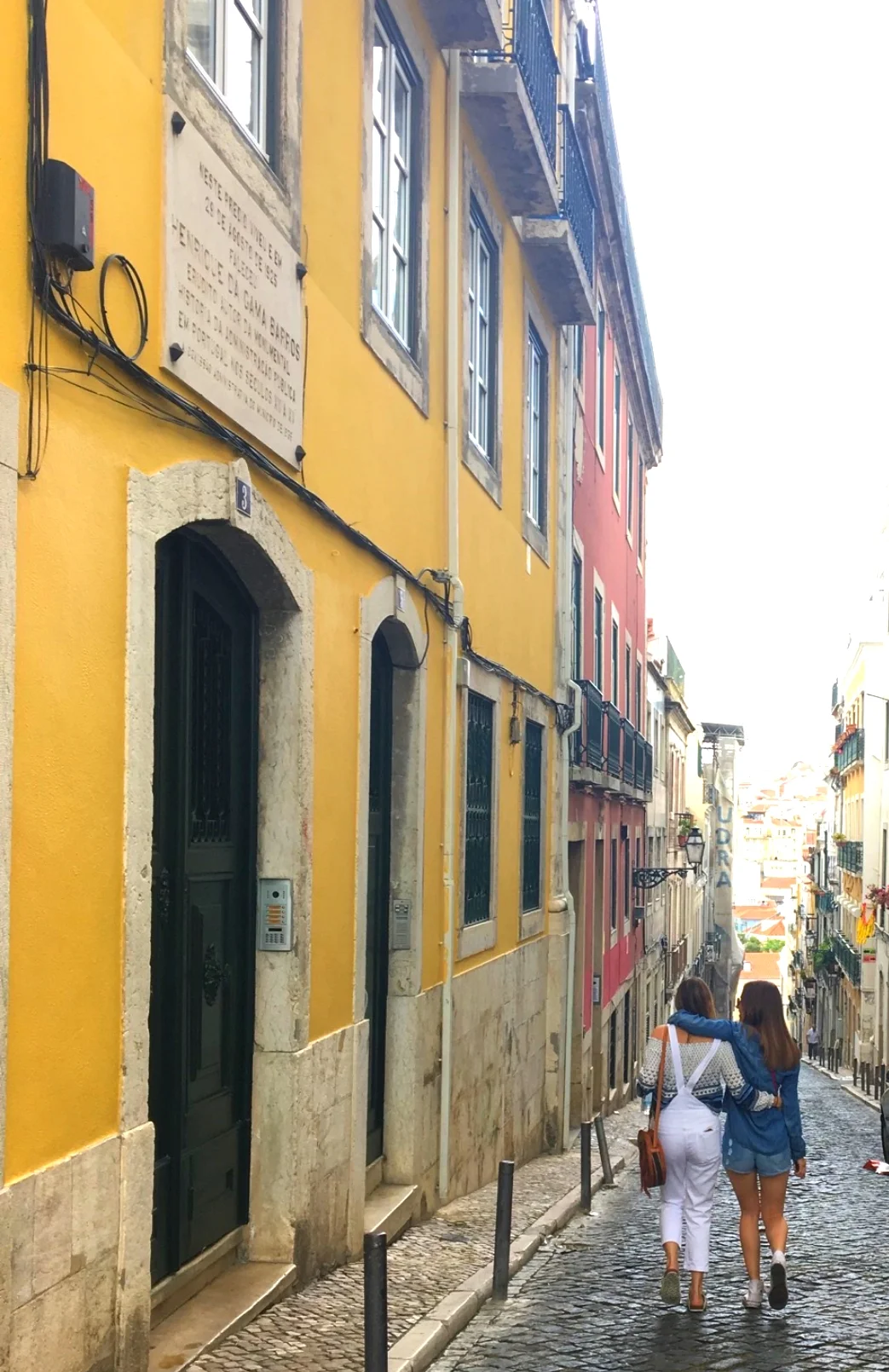 Amanda and her sister, Vikki, walking the streets of Lisbon.