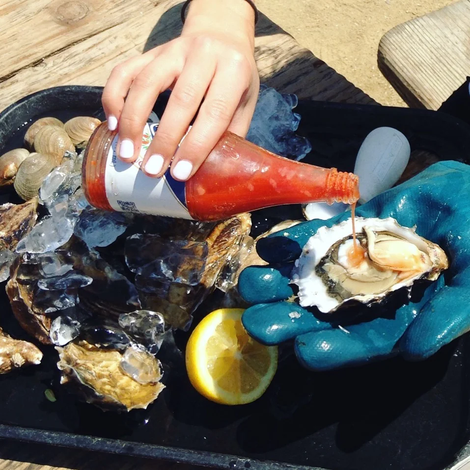 The freshest oysters + lemon and hot sauce.