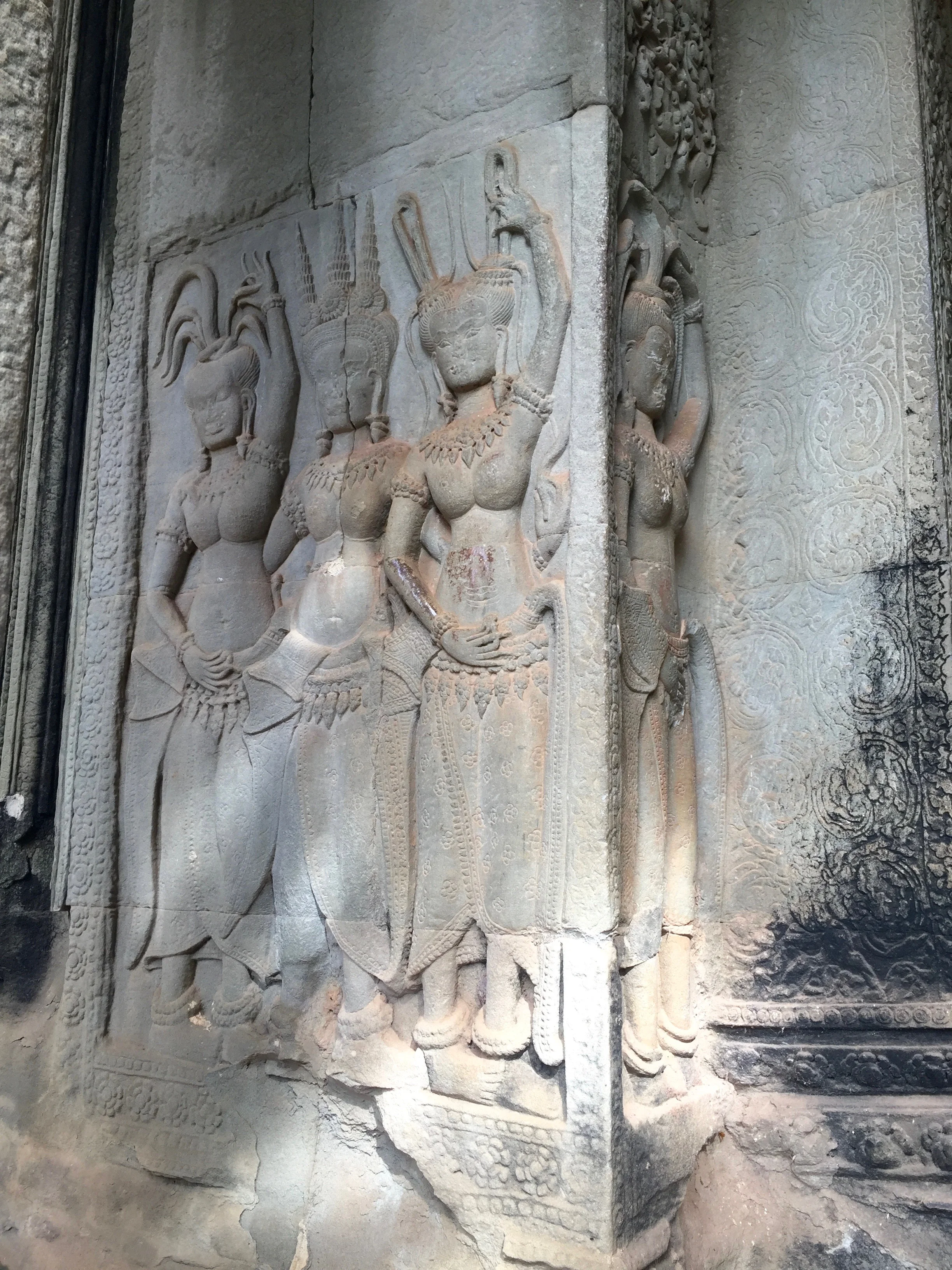 Angkor Wat is covered in intricate carvings. This is Apsara , a female spirit of clouds and water according to Hindu and Buddhist mythology. 