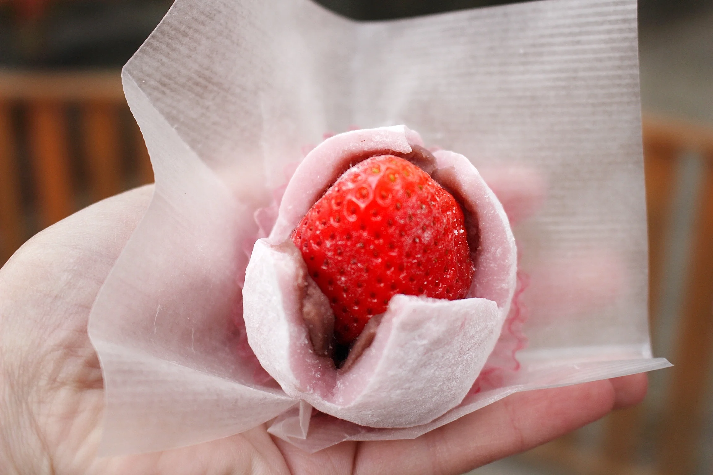 Mochi is a rice cake made in Japan and eaten as dessert. This was stuffed with red bean paste and a fresh strawberry. Yum!