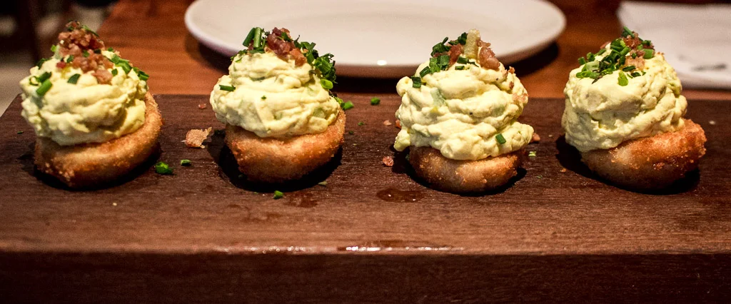 Lightly fried deviled eggs with bacon on top. I’m still dreaming about these. Find them at Nick’s Laguna Beach .
