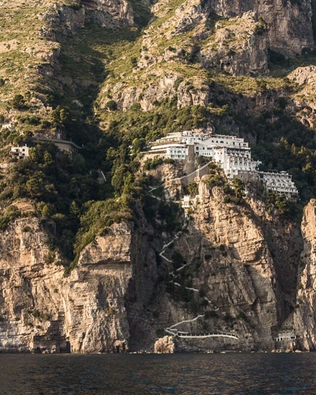 A cliffside hotel in Amalfi, Italy. Our boat captain told us there&rsquo;s an elevator that take you to the beach! #amalficoast #italy #twobluepassports #honeymoon