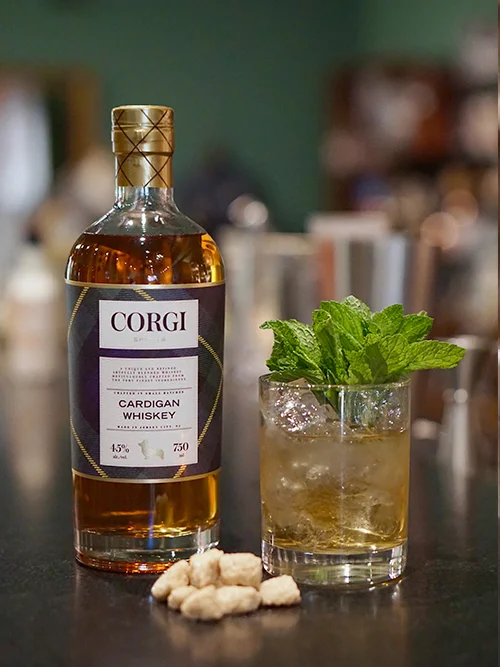 MINT JULEP 2 oz Corgi Spirits Cardigan Whiskey 1 oz sweet vermouth 2 dashes Angostura bitters 1 dash orange bitters Add all the ingredients into a mixing glass with ice, and stir until well-chilled. Strain into a chilled coupe. Garnish with a brandied cherry.