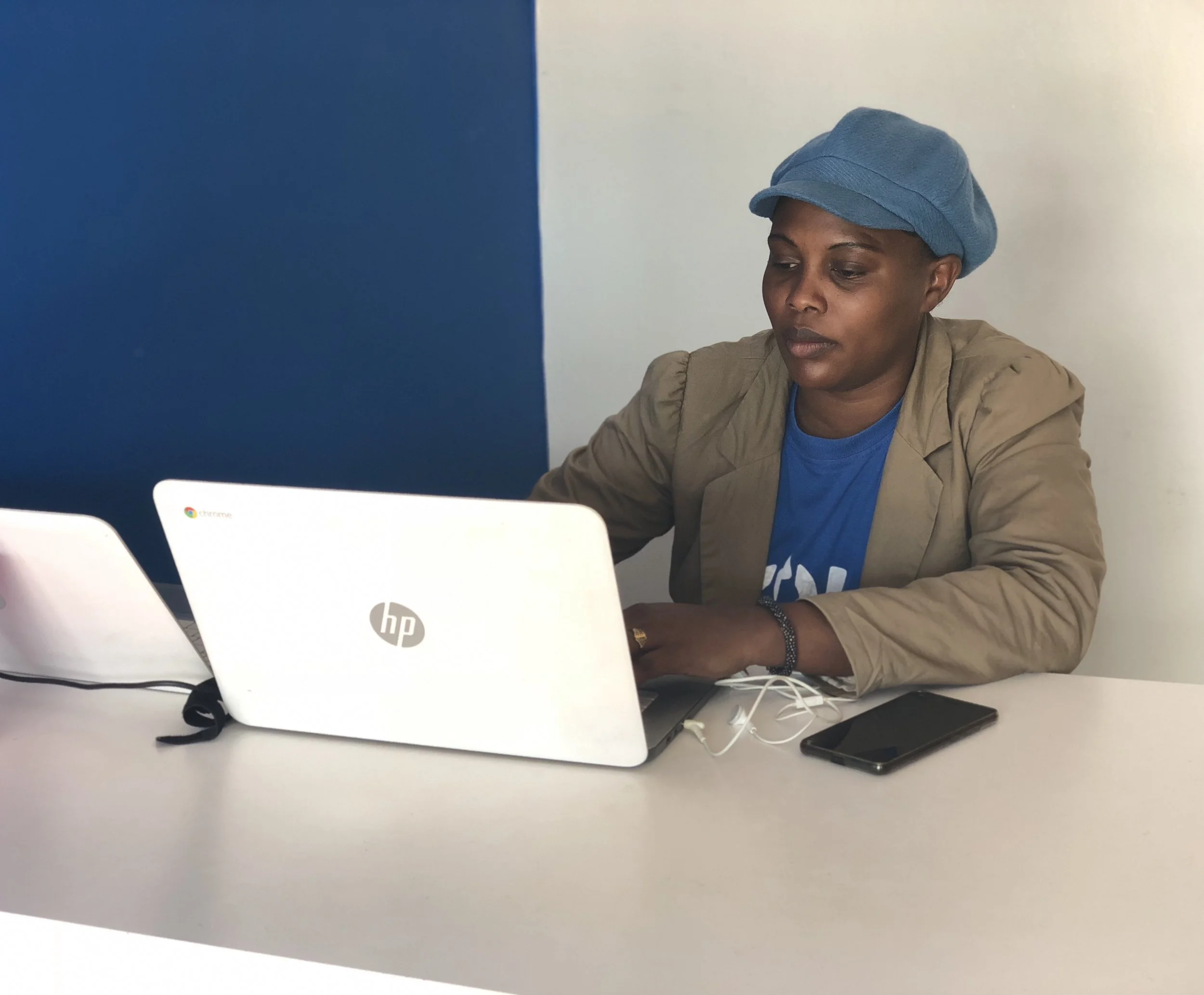 Jackie working at her desk with ZOLA