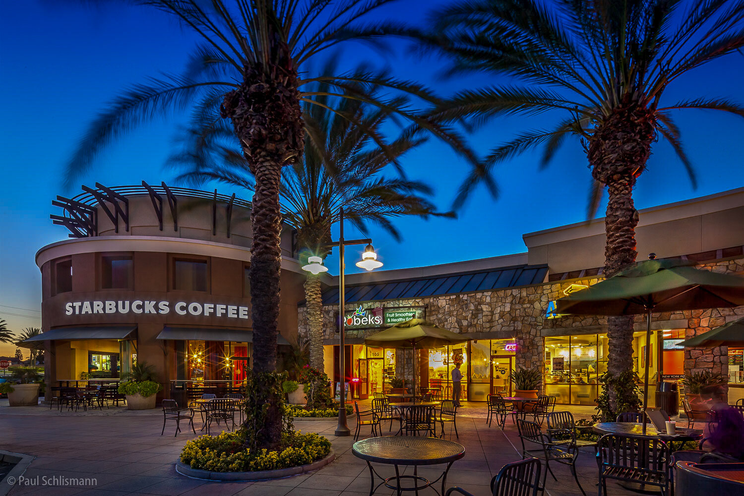 Dusk view of shopping center in CA