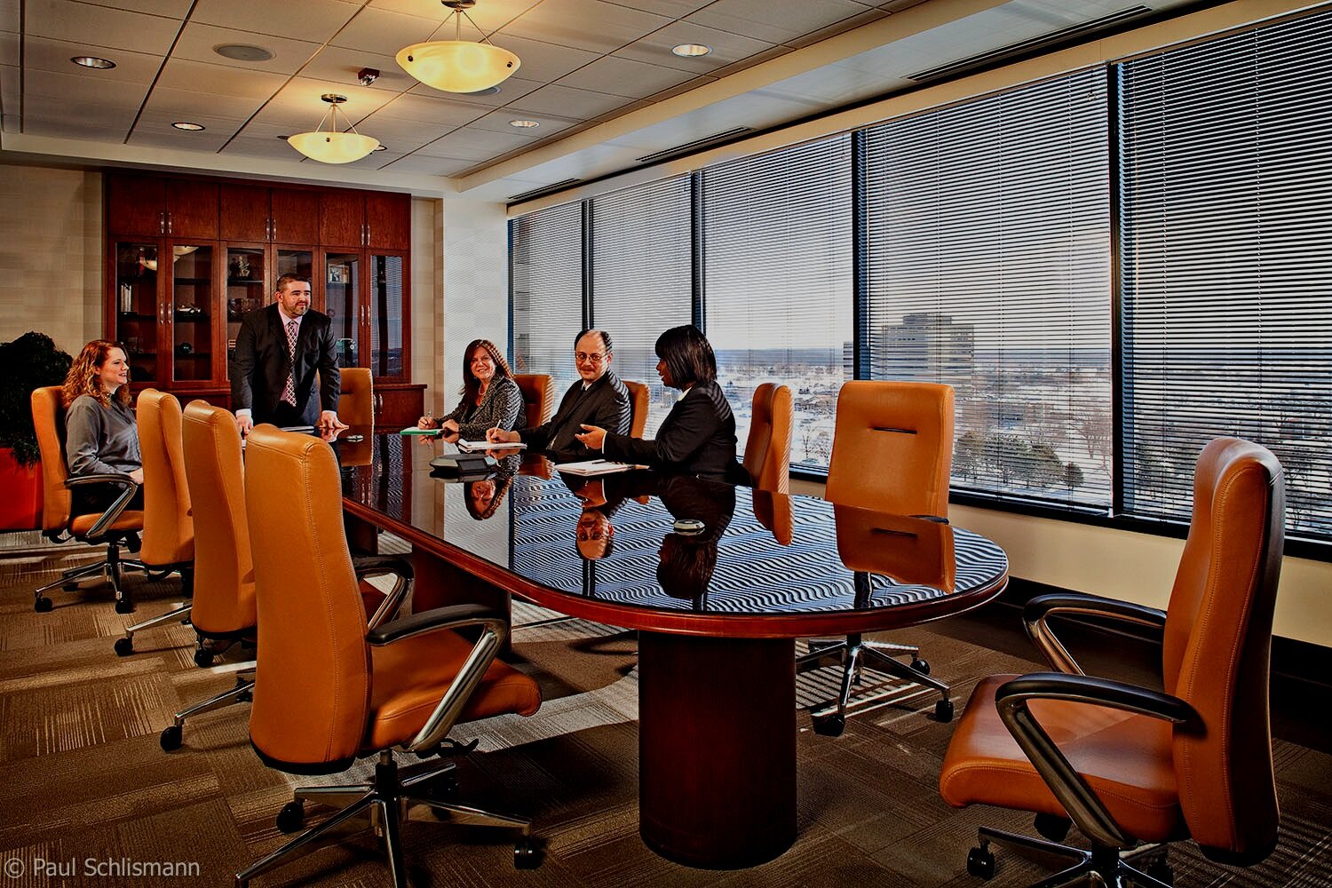 Milwaukee corporate photographer | Group action shot in conference room