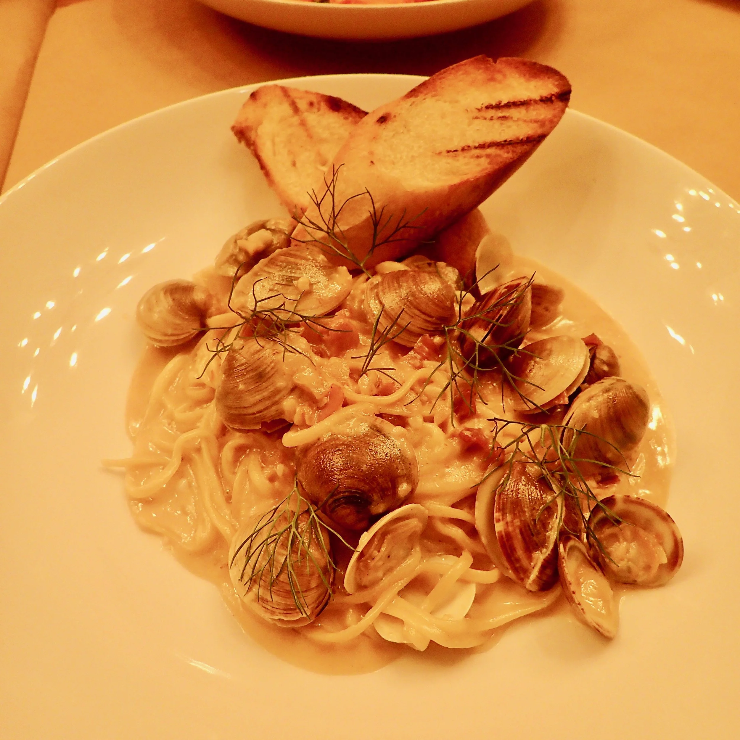Housemade linguine with smallneck clams, pancetta, fennel and fronds in a lemon-white wine sauce at Sette Orlando.
