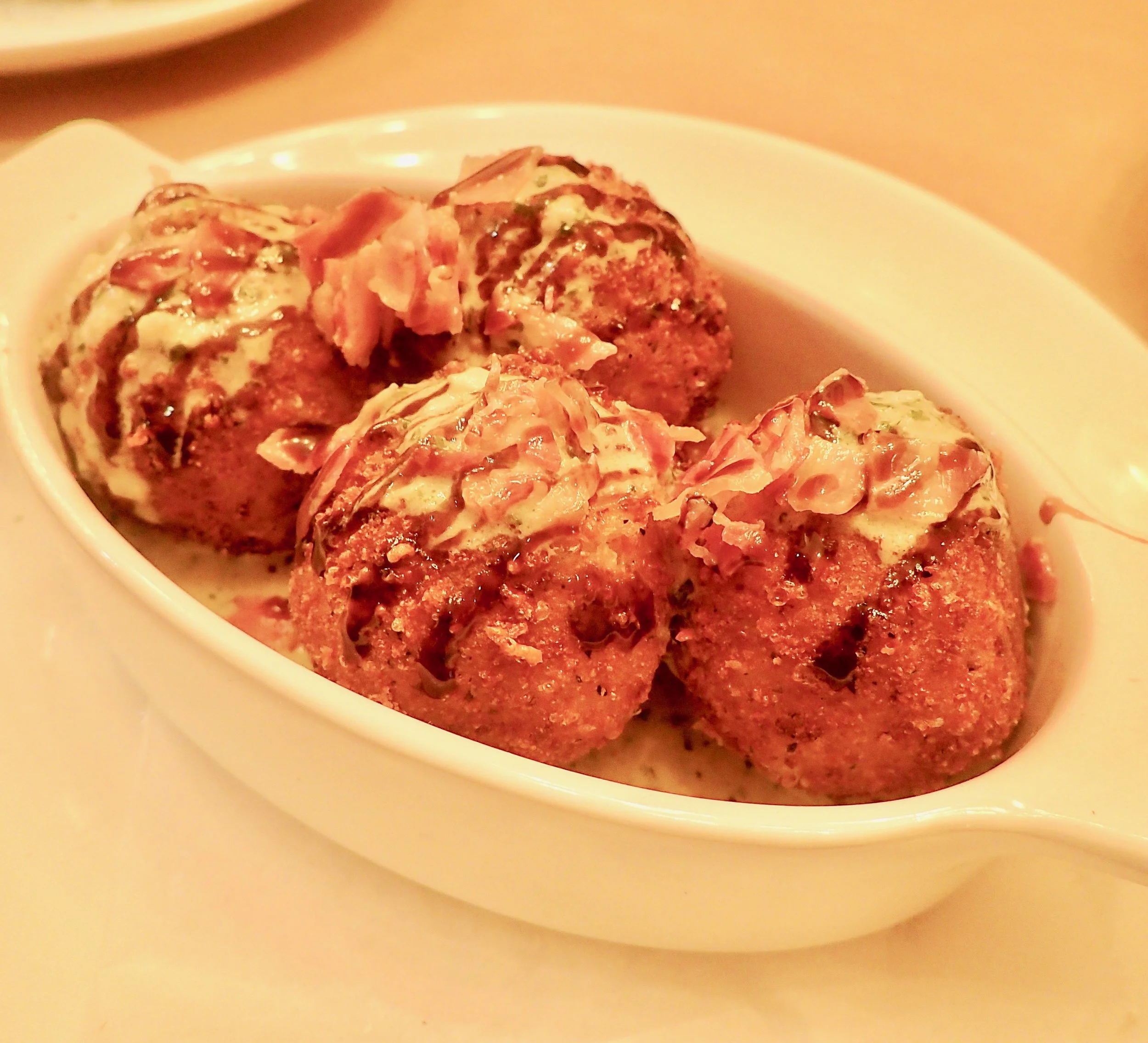 Vegetarian meatballs made with eggplant. They’re good enough that meat eaters will order them too.