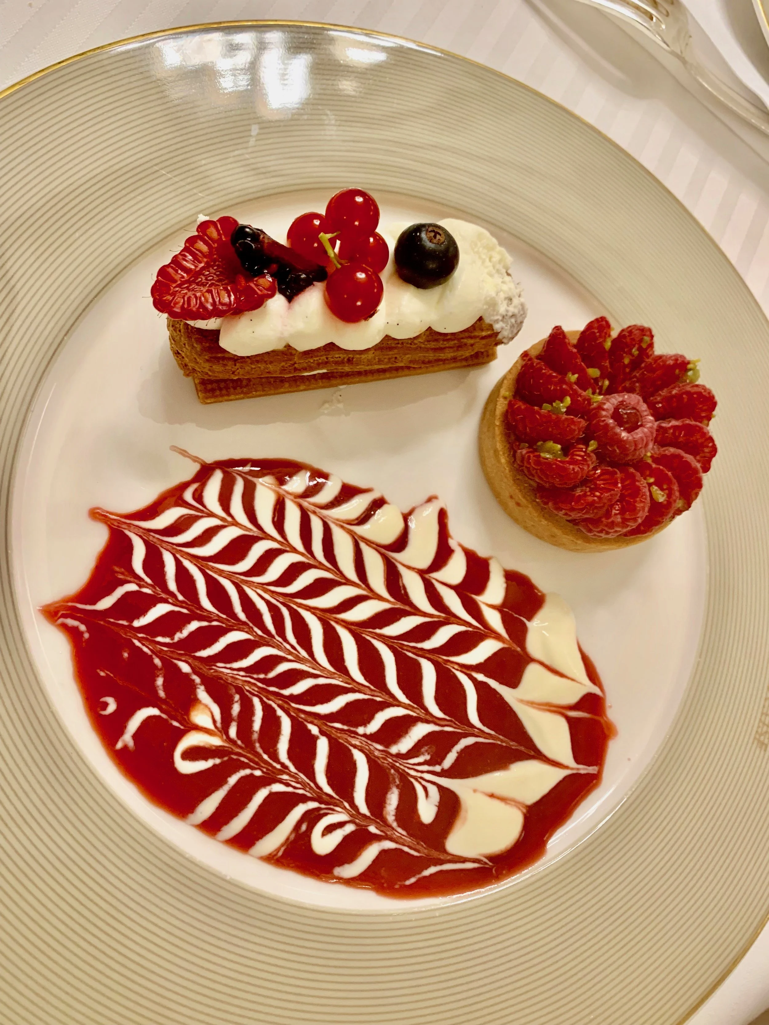 Two of the many, many dessert on offer, with some sauce painting.